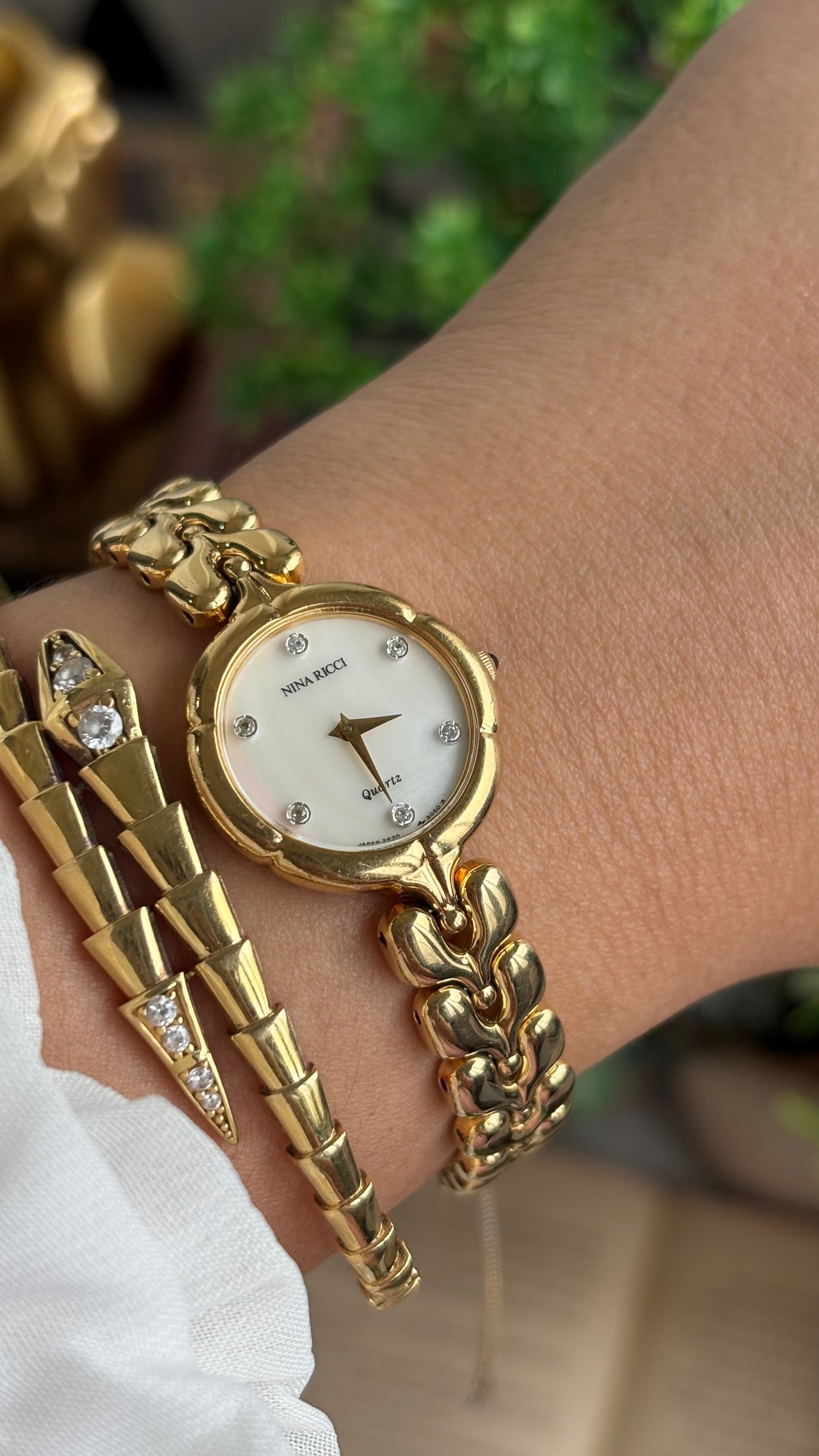Vintage Nina Ricci Watch in Gold Tone Mother of Pearl Dial Flower Art Deco