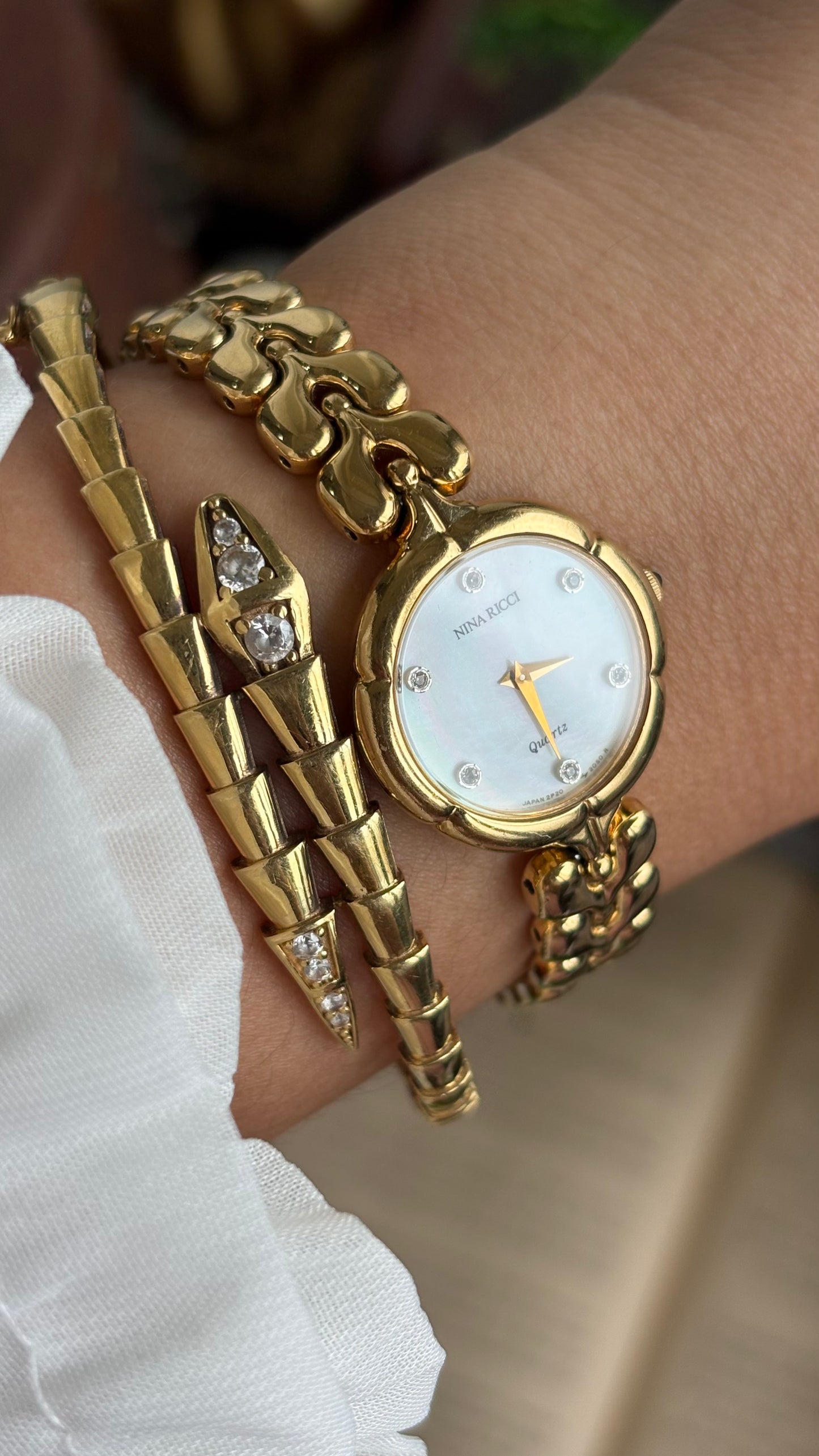 Vintage Nina Ricci Watch in Gold Tone Mother of Pearl Dial Flower Art Deco