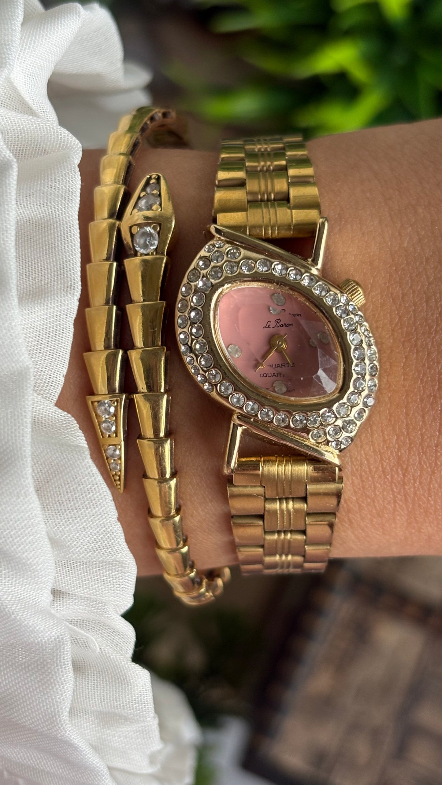 Vintage Le Baron Bejeweled Watch in Gold Tone Pink Dial Leaf Face Shape