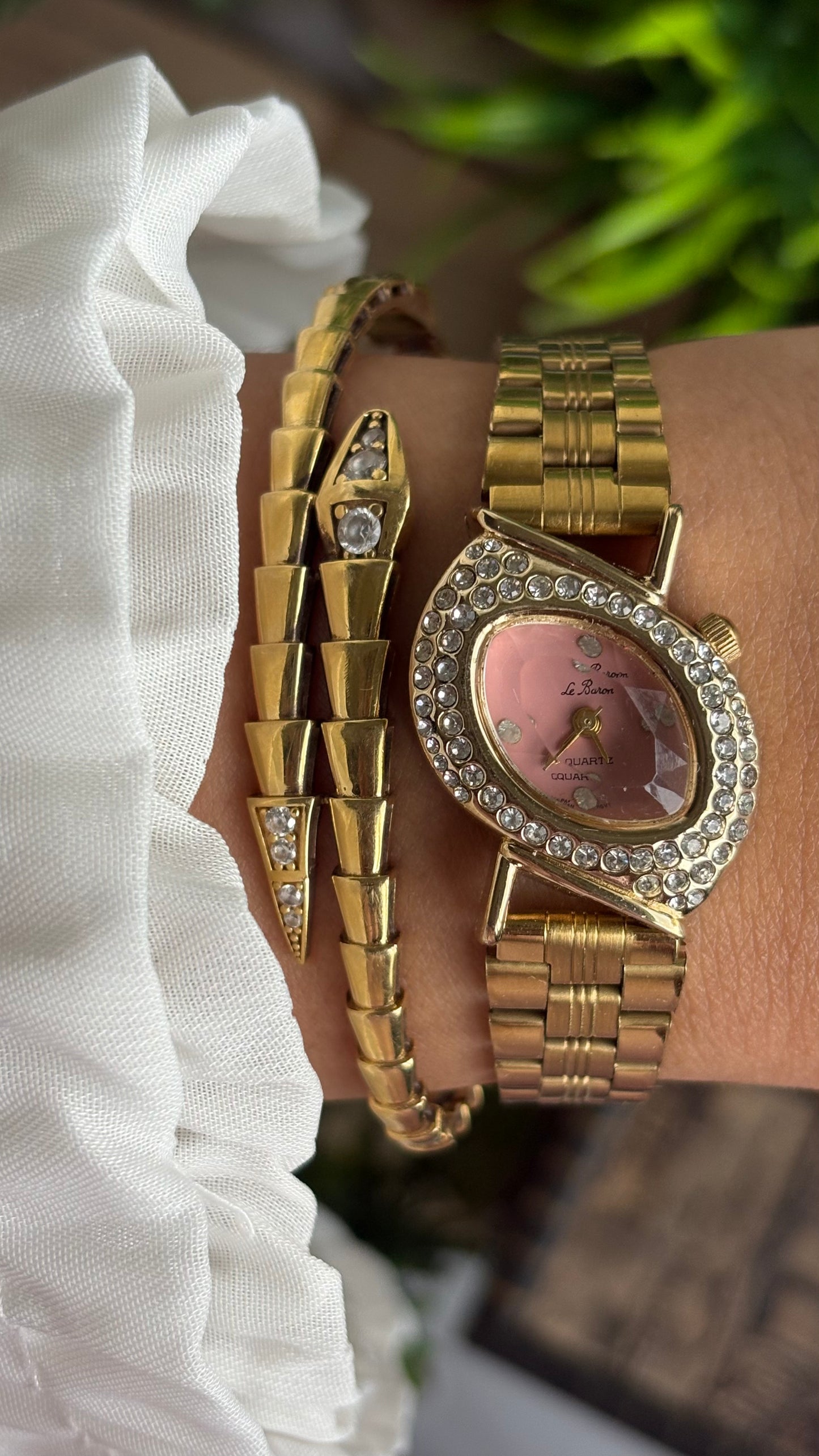 Vintage Le Baron Bejeweled Watch in Gold Tone Pink Dial Leaf Face Shape