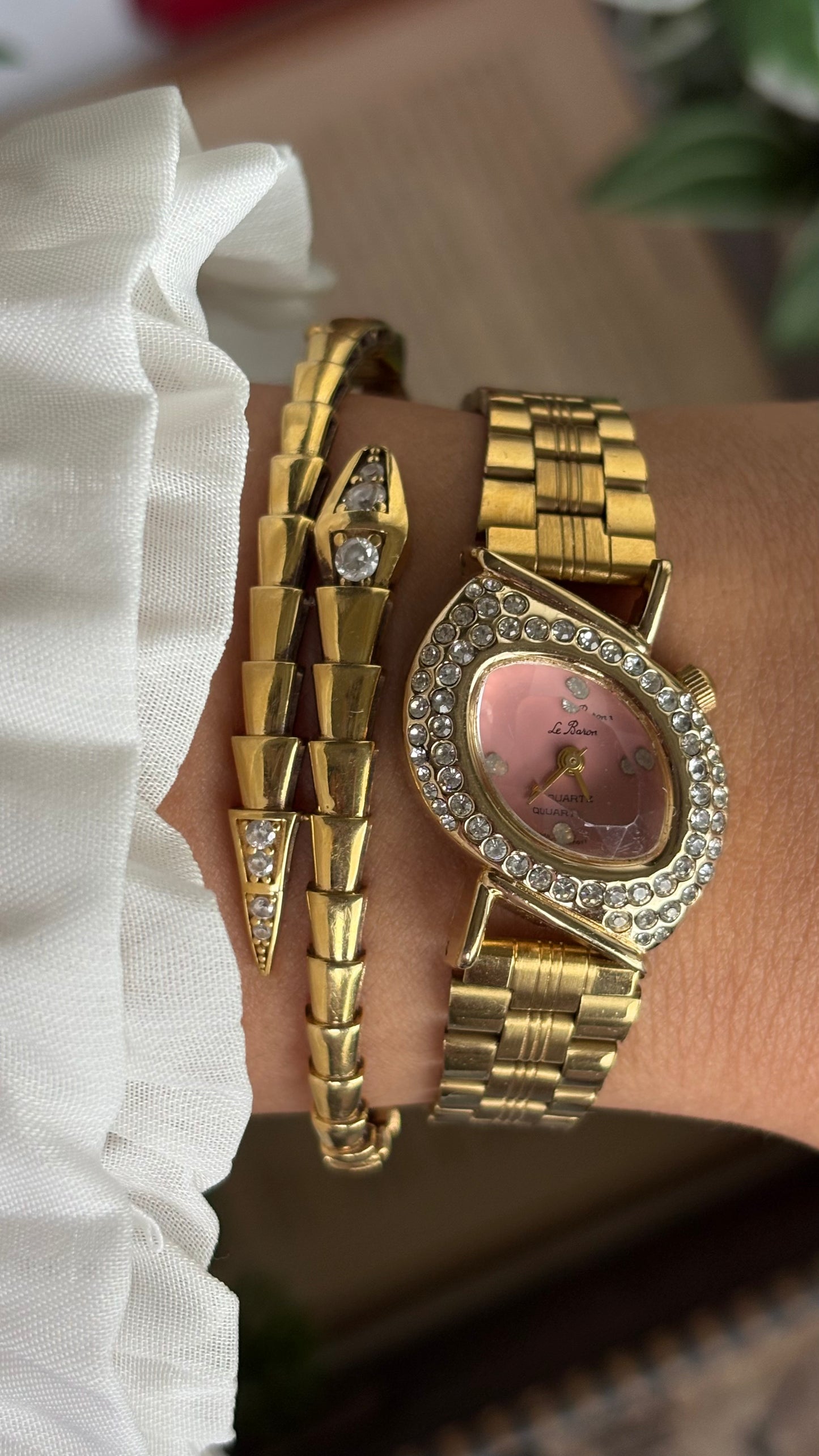 Vintage Le Baron Bejeweled Watch in Gold Tone Pink Dial Leaf Face Shape