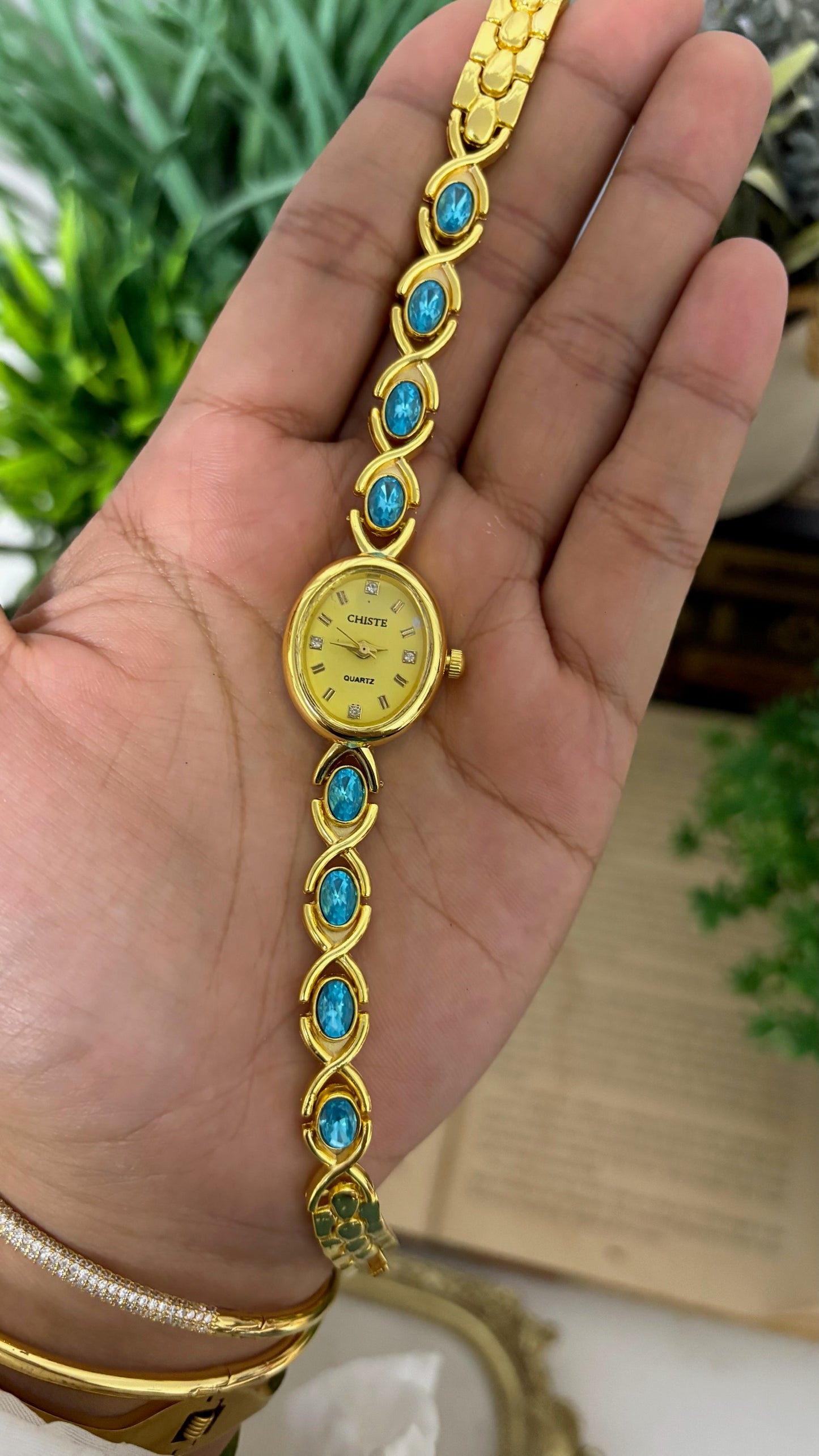Vintage Chiste Oval Crystal Accent Watch with Blue Stone Inlay Link Bracelet in Gold Tone Champagne Dial Quartz