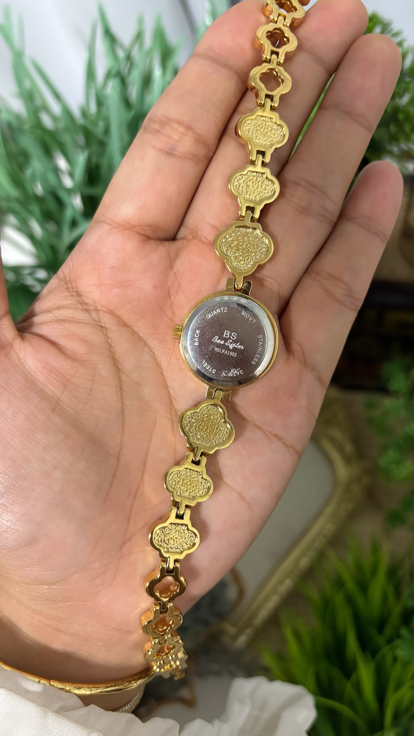 Vintage BS Bee Sister Round Watch with White Dial, Polished Gold Tone Bezel, and Quatrefoil Clover Link Bracelet Alternating with Crystal Pave and White Inlay Details Quartz