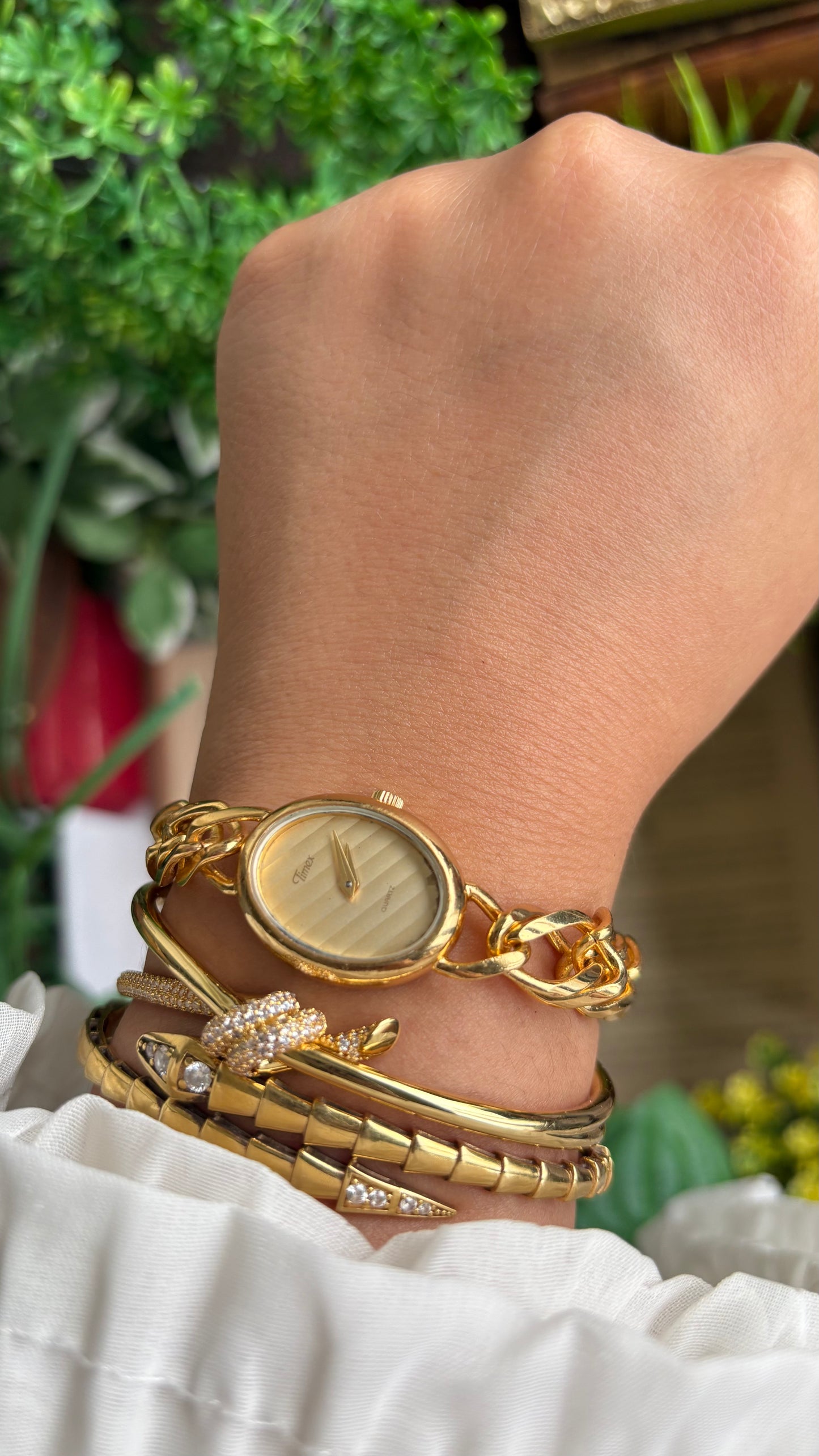 Vintage Timex Bracelet Watch in Gold Tone Oval Face Textured Dial