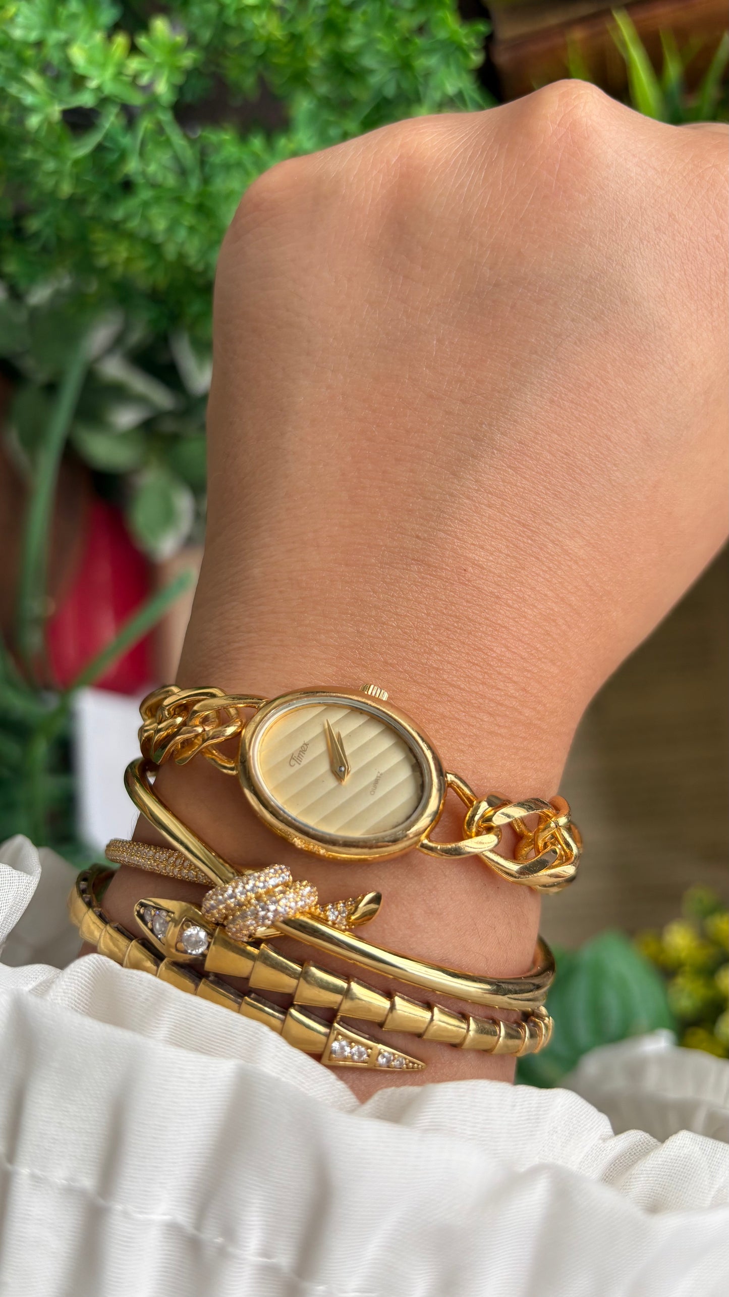 Vintage Timex Bracelet Watch in Gold Tone Oval Face Textured Dial