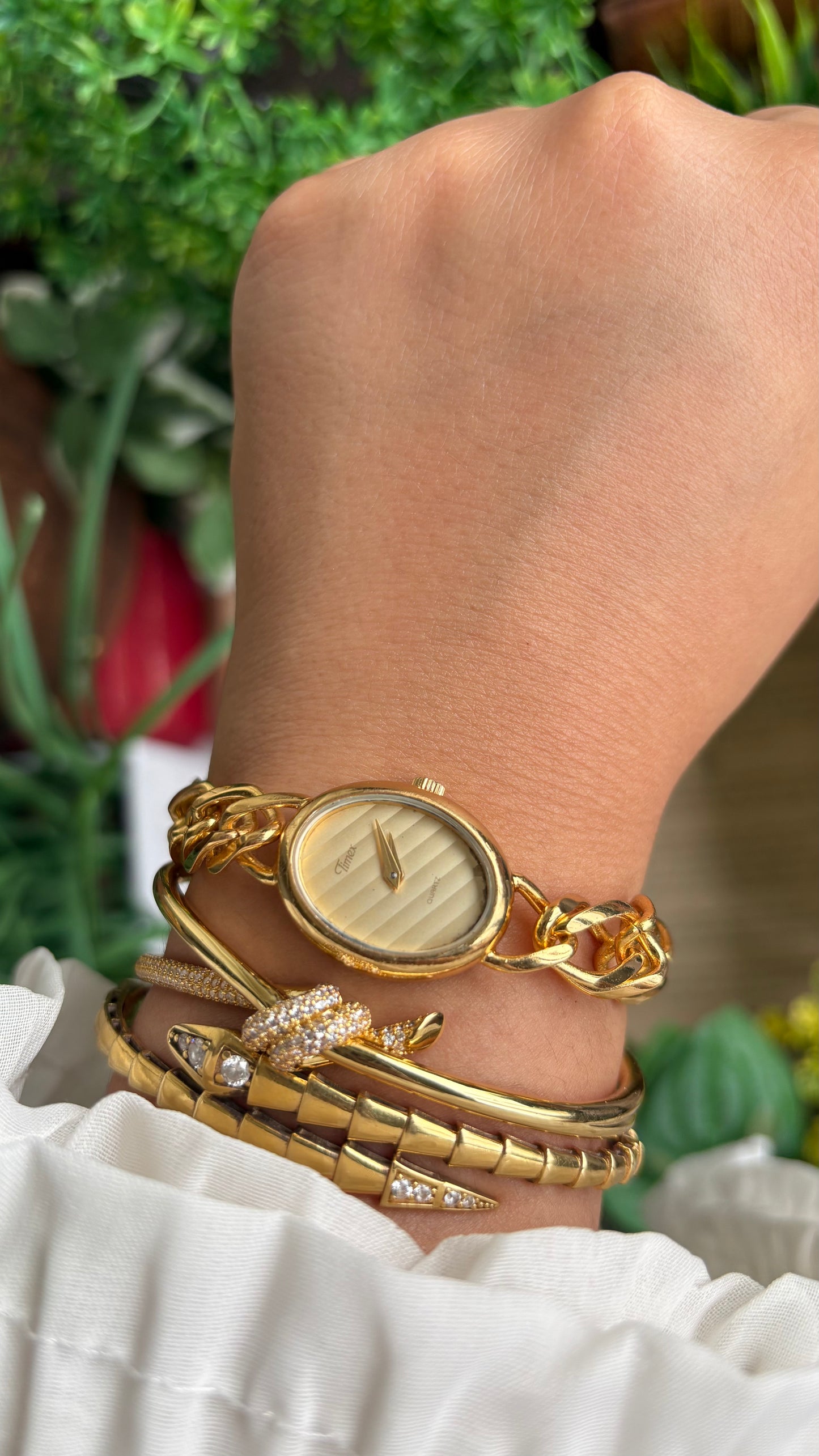 Vintage Timex Bracelet Watch in Gold Tone Oval Face Textured Dial