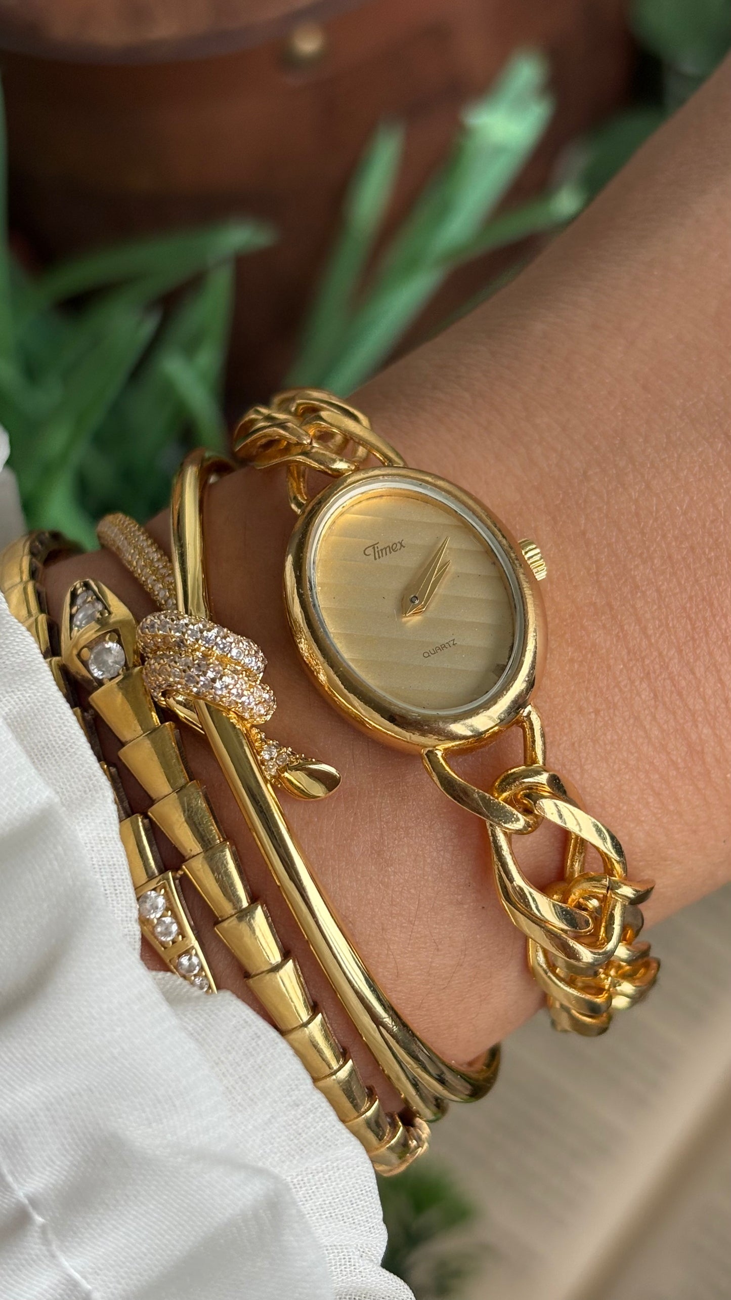 Vintage Timex Bracelet Watch in Gold Tone Oval Face Textured Dial