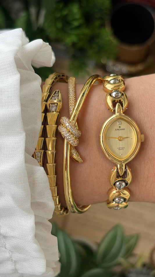 Vintage Dainty Junghans Astra Watch in Gold Tone Almond Dial Quartz