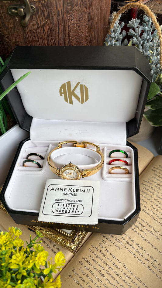 Vintage Anne Klein Swiss Interchangeable Bezel Set Bangle Watch in Gold Tone Roman Dial