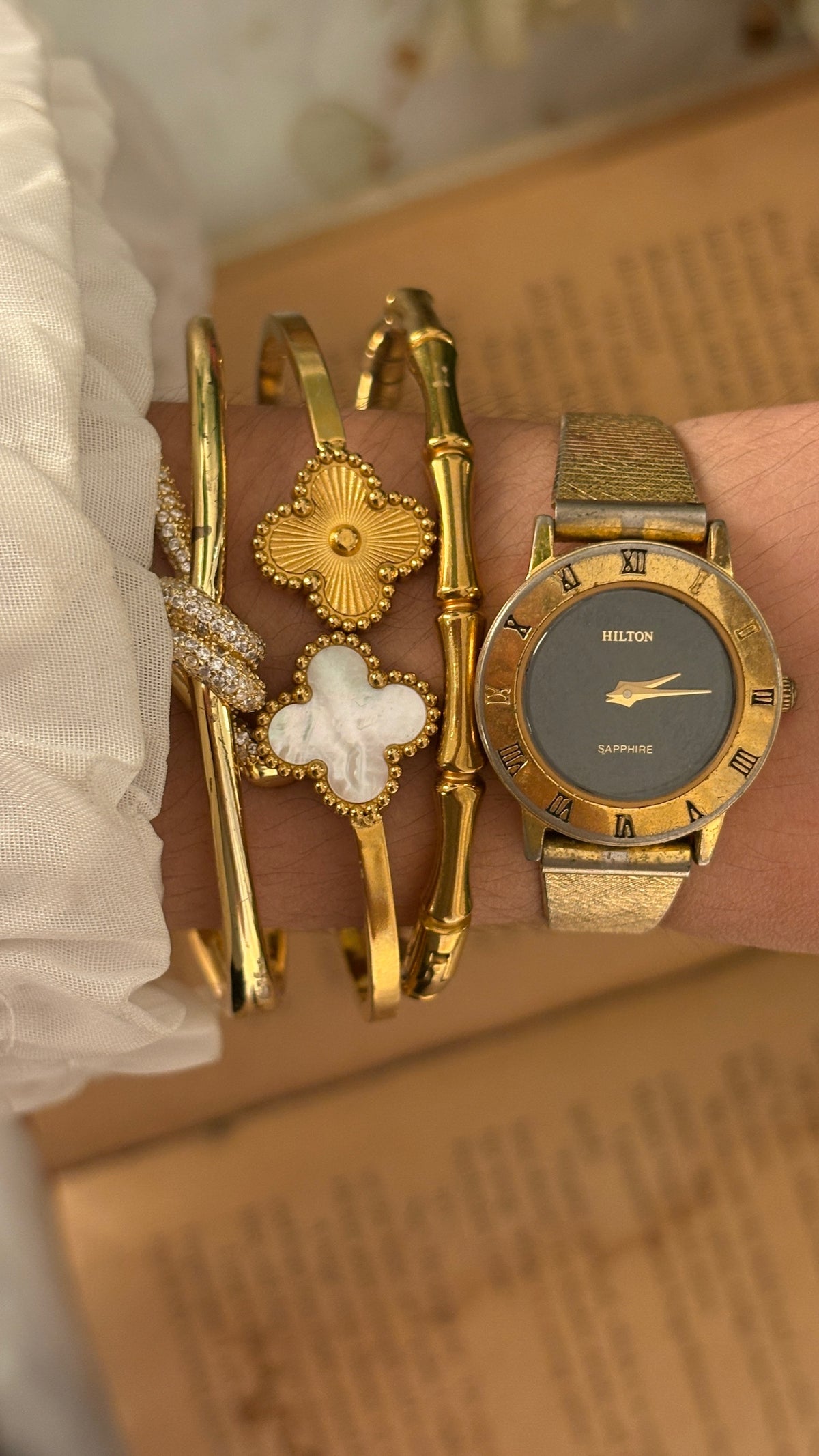 Rare Vintage Hilton Black Dial Sapphire Glass Dress Watch in Gold Tone Quartz