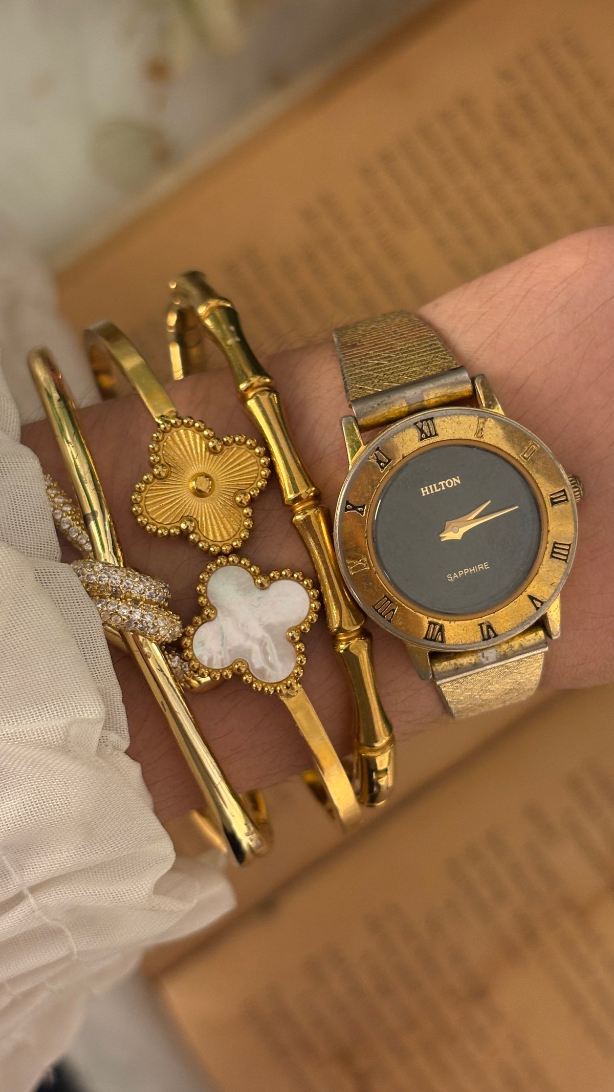 Rare Vintage Hilton Black Dial Sapphire Glass Dress Watch in Gold Tone Quartz