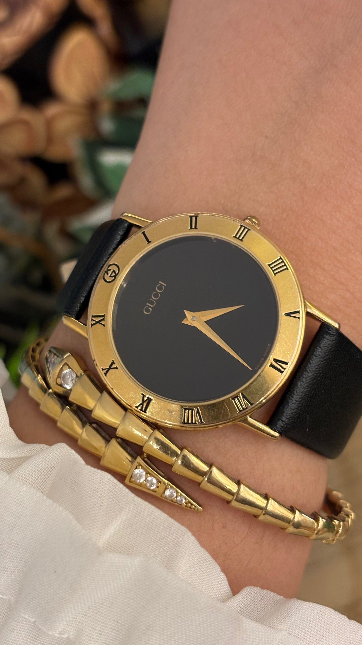 Vintage Gucci Swiss 3000 M Engraved Roman Bezel Mens Watch in Gold Tone Black Leather Blackout Dial Quartz