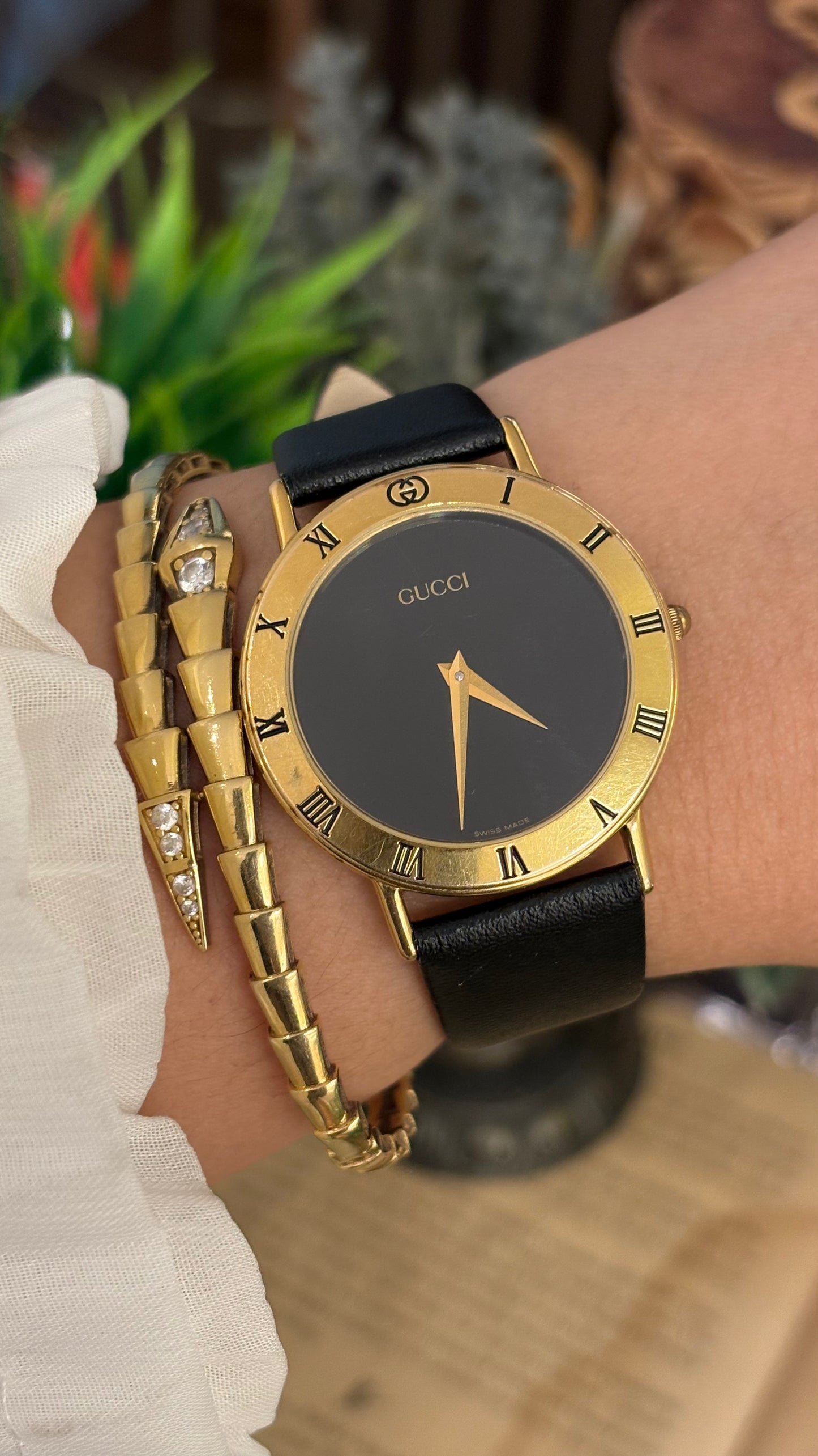 Vintage Gucci Swiss 3000 M Engraved Roman Bezel Mens Watch in Gold Tone Black Leather Blackout Dial Quartz
