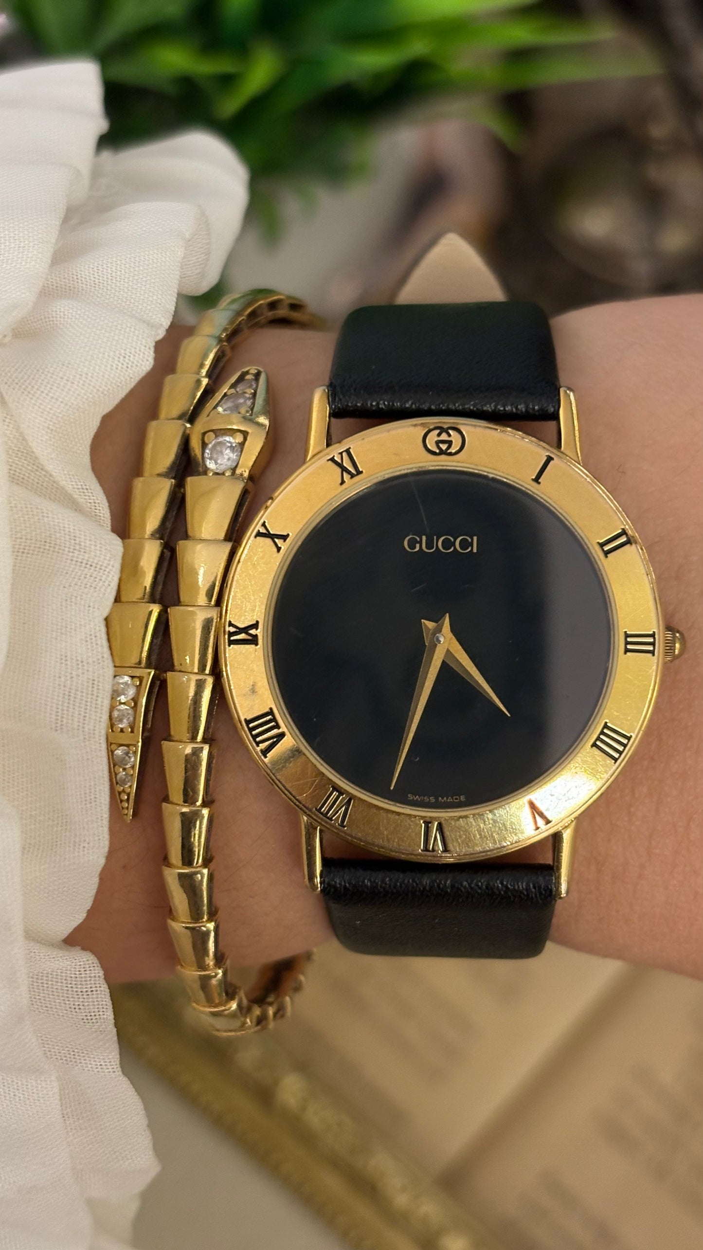 Vintage Gucci Swiss 3000 M Engraved Roman Bezel Mens Watch in Gold Tone Black Leather Blackout Dial Quartz