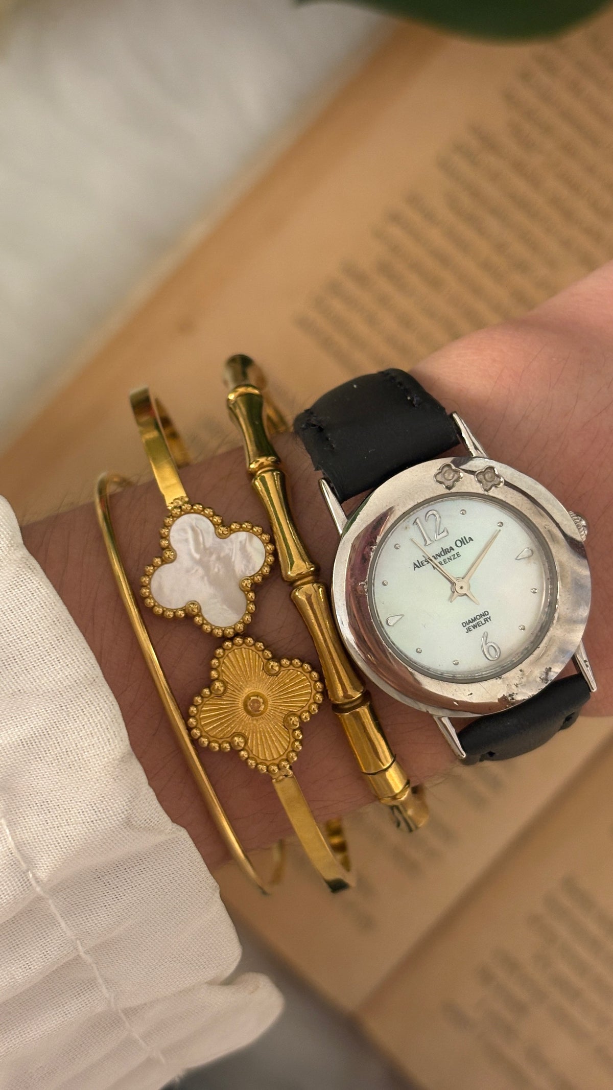Rare Vintage Alessandra Olla Mother of Pearl Dial Flower Accent Watch in Silver Tone Black Leather Quartz