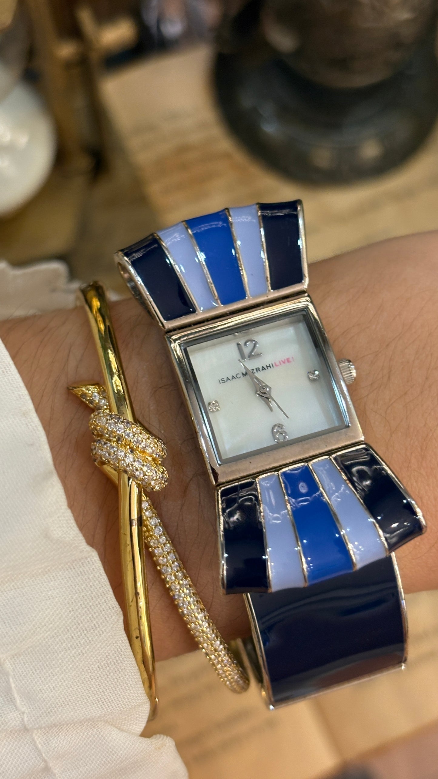 Rare Vintage Isaac Mizrahi Ribbon Motif Bangle Watch in Silver Tone Mother of Pearl Dial Quartz