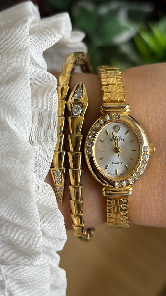 Vintage Sarah Coventry Bejeweled Watch in Gold Tone Oval Face Stretch Band