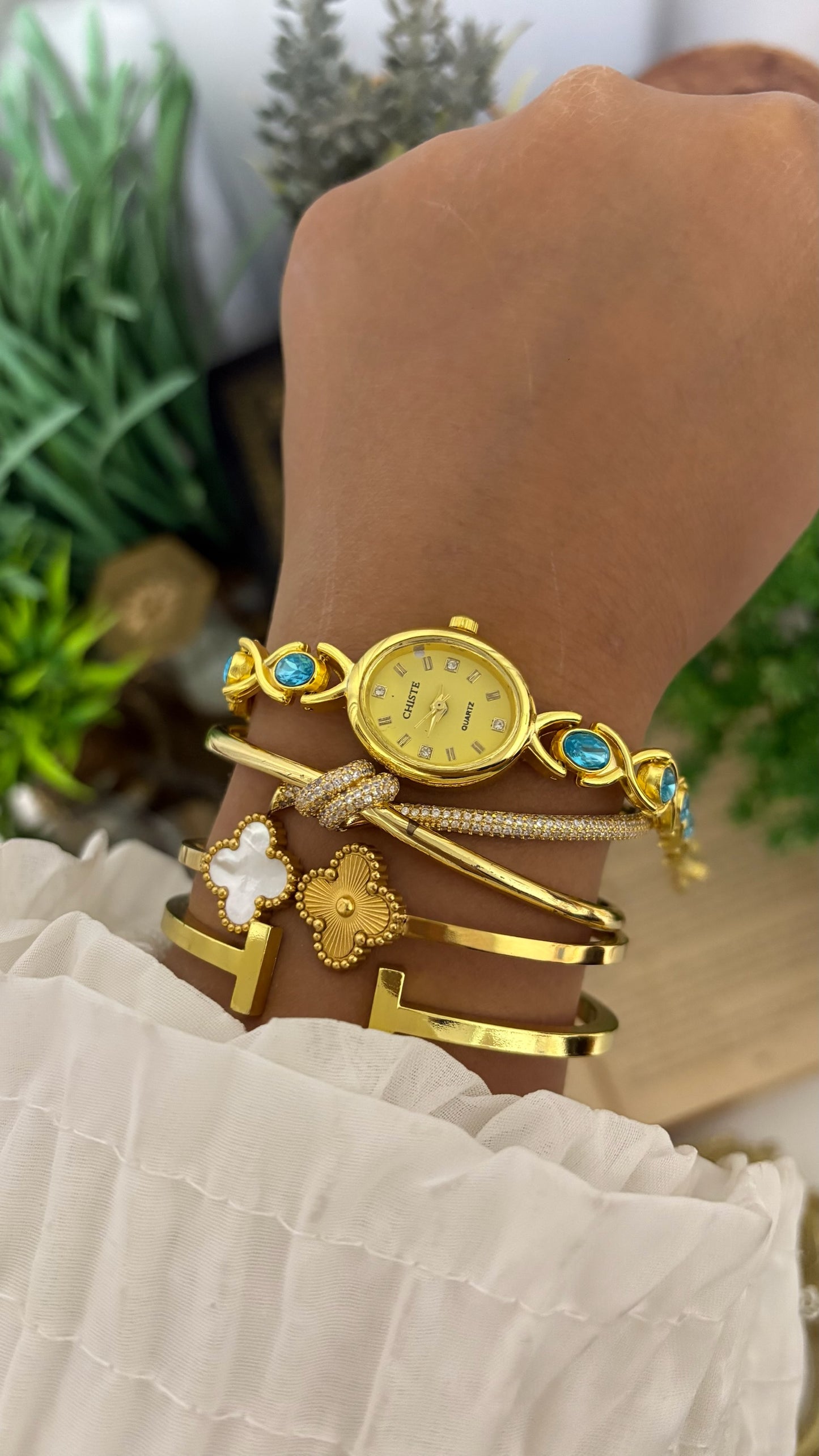 Vintage Chiste Oval Crystal Accent Watch with Blue Stone Inlay Link Bracelet in Gold Tone Champagne Dial Quartz
