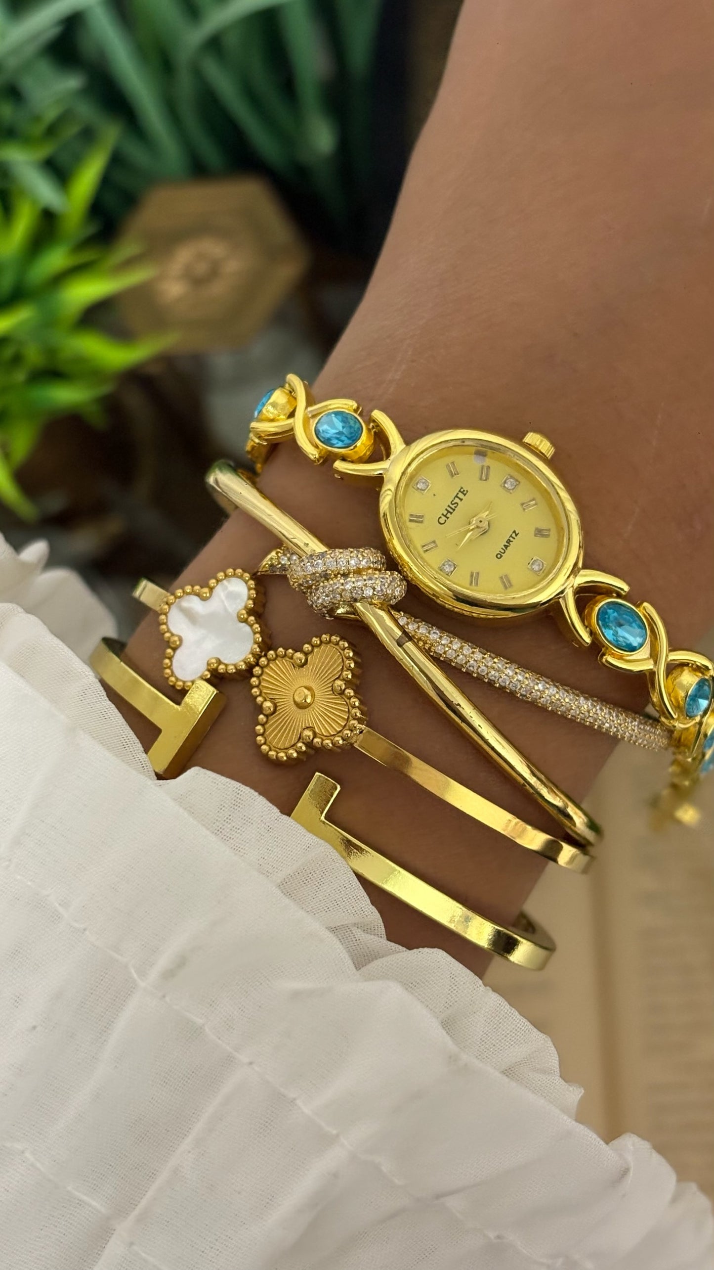 Vintage Chiste Oval Crystal Accent Watch with Blue Stone Inlay Link Bracelet in Gold Tone Champagne Dial Quartz