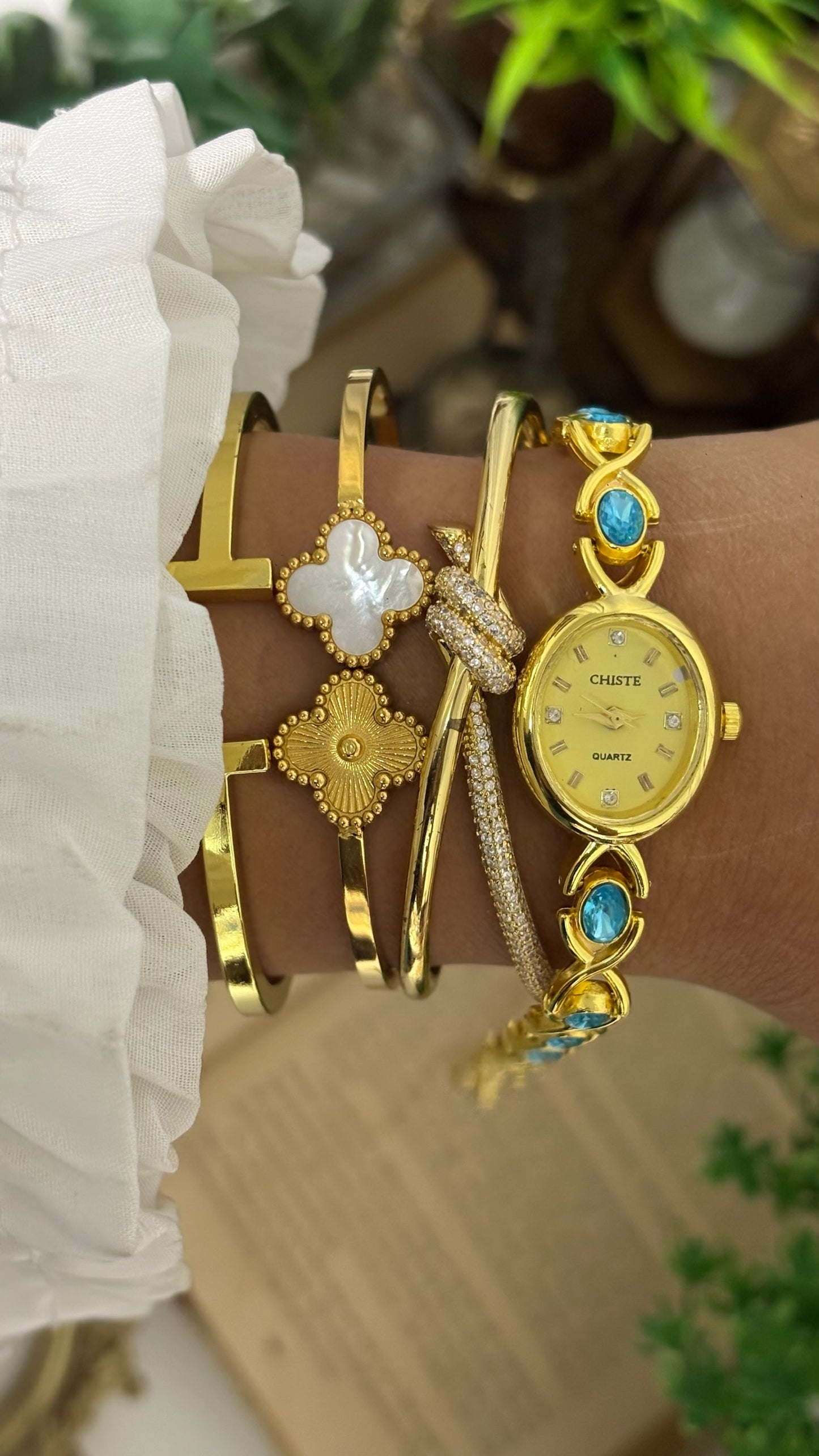 Vintage Chiste Oval Crystal Accent Watch with Blue Stone Inlay Link Bracelet in Gold Tone Champagne Dial Quartz