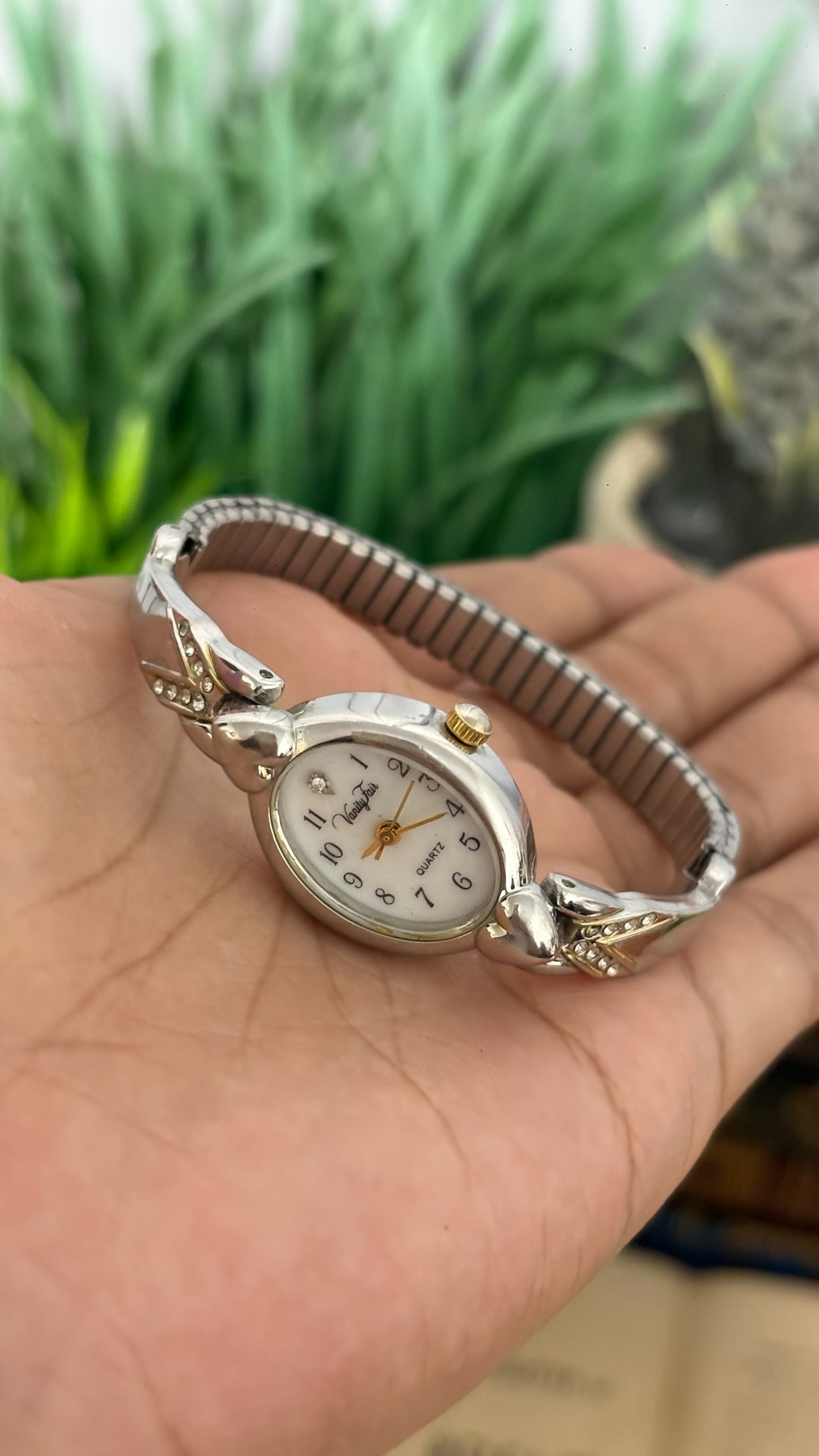 Vintage Vanity Fair Oval Face Crystal Accent Watch with Heart Lugs and Expansion Band in Silver Tone White Dial Quartz