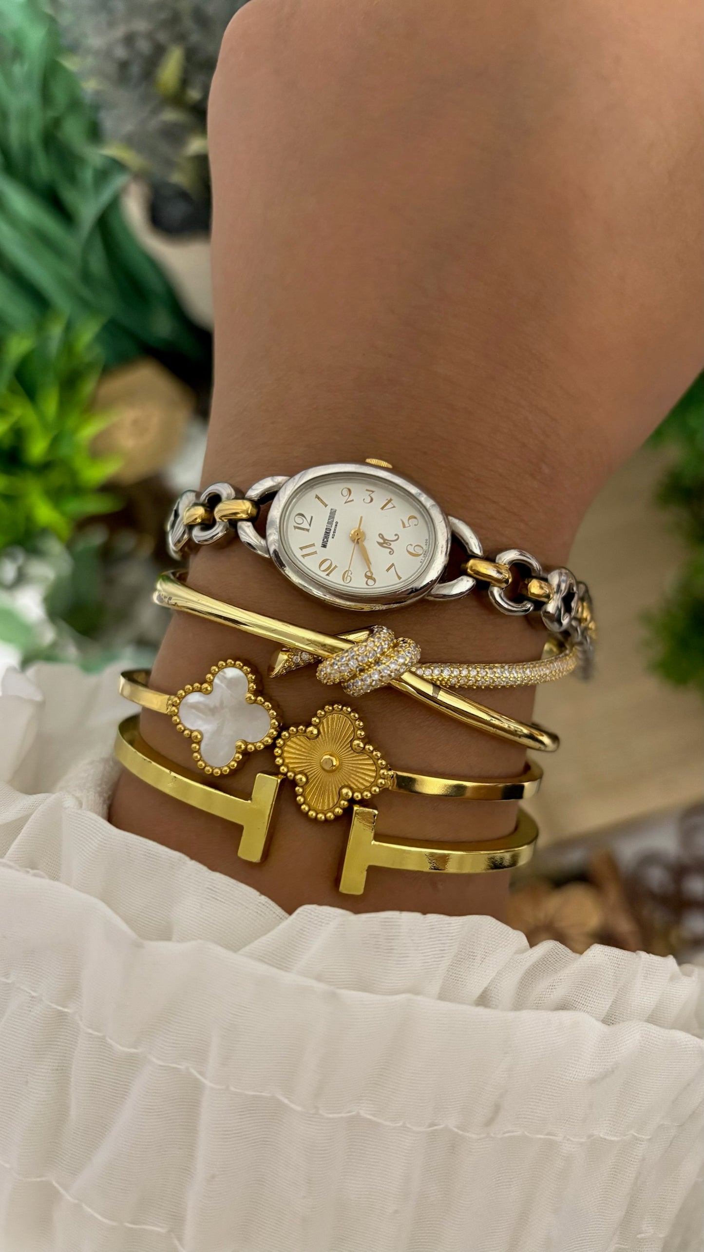Vintage Michiko London Koshino Oval Case Watch with Two-Tone Interlocking Figure-8 Link Bracelet and Star Cutouts in Silver and Gold Tone White Dial Quartz