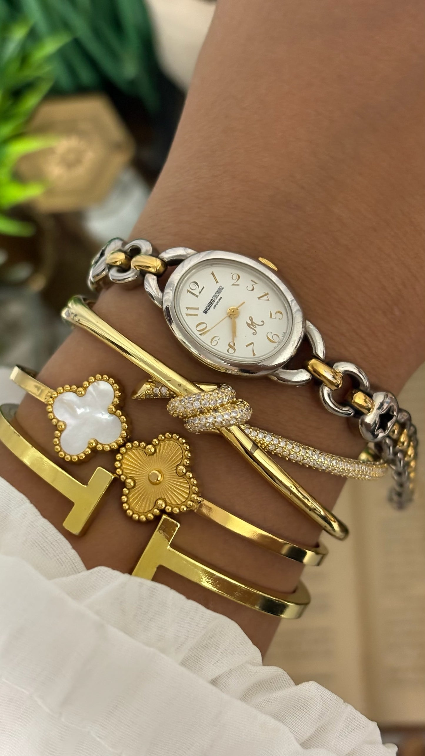 Vintage Michiko London Koshino Oval Case Watch with Two-Tone Interlocking Figure-8 Link Bracelet and Star Cutouts in Silver and Gold Tone White Dial Quartz