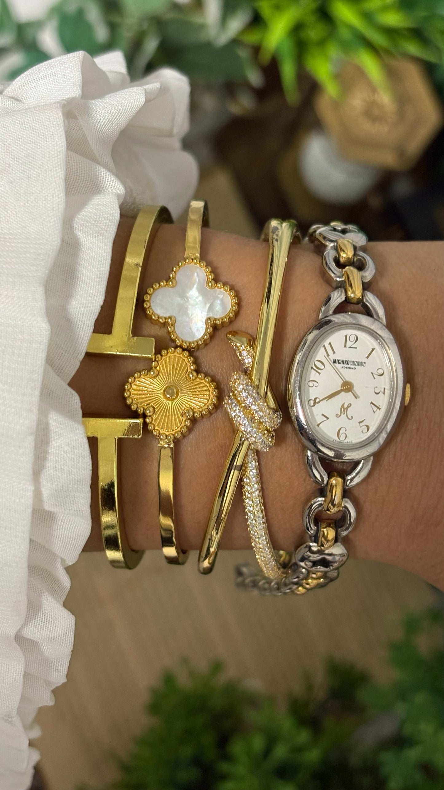 Vintage Michiko London Koshino Oval Case Watch with Two-Tone Interlocking Figure-8 Link Bracelet and Star Cutouts in Silver and Gold Tone White Dial Quartz