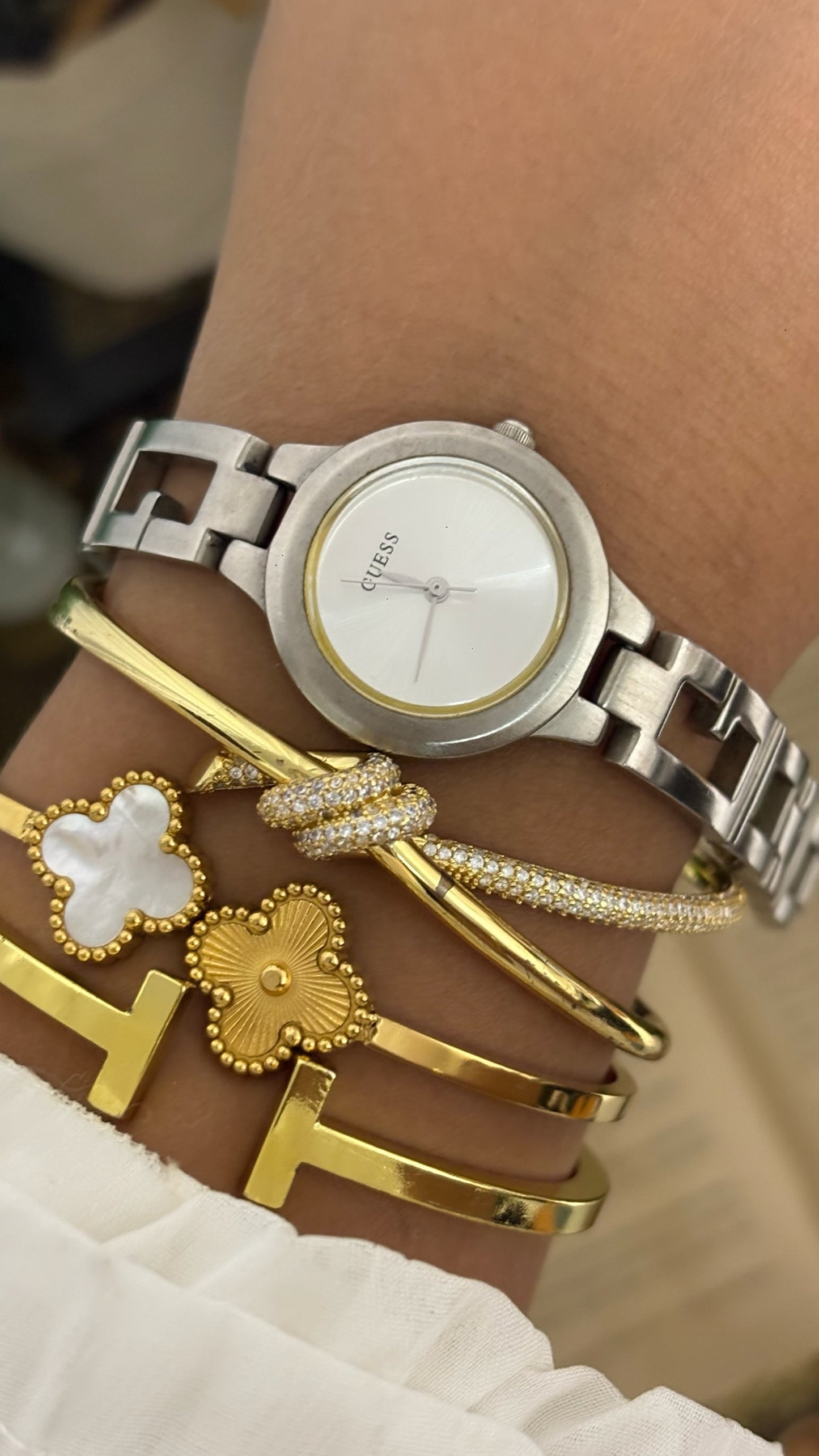 Vintage Guess Round Dress Watch with Thick Crystal-Set Bezel, Crystal Hour Markers, and White Ceramic Panel Link Bracelet in Gold Tone White Dial Quartz