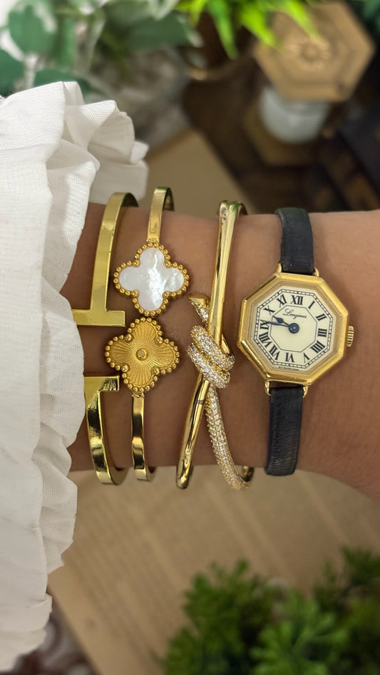 Vintage Longines Octagonal Dress Watch with Roman Numeral Track, Blued Steel Hands, and Original Signed Winged Hourglass Buckle on Slim Black Leather Strap in Gold Tone Dial Quartz