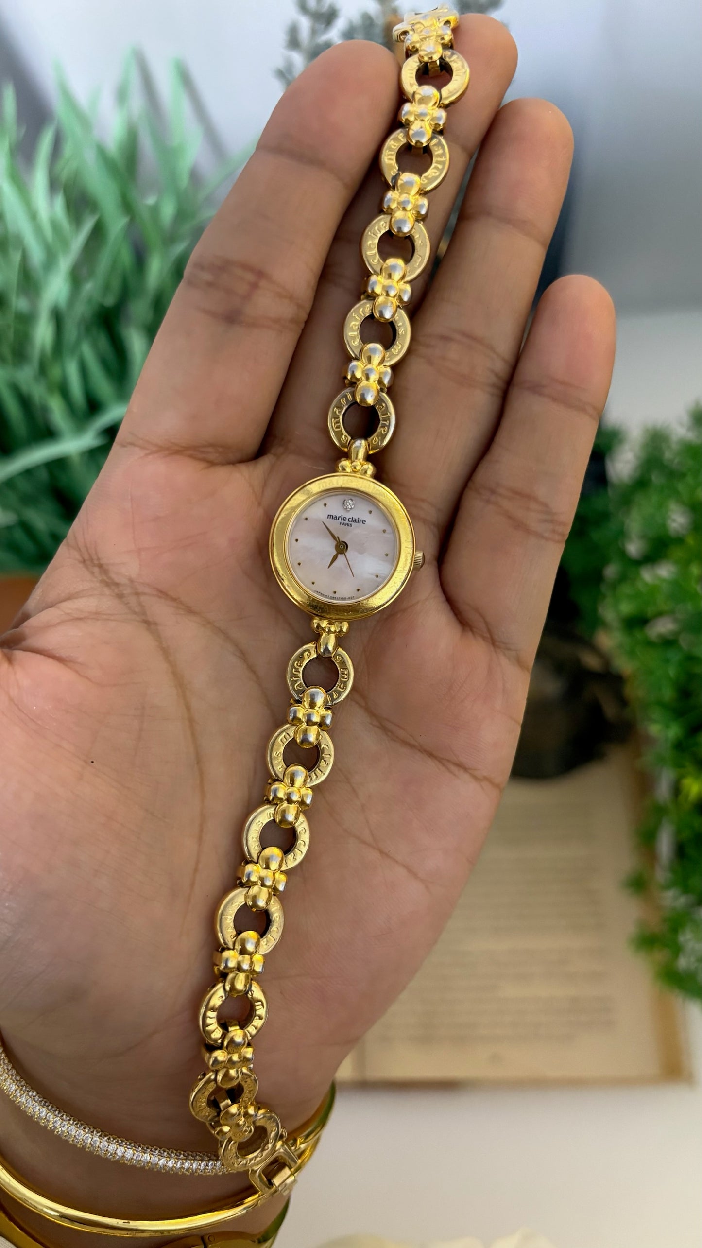 Vintage Marie Claire Round Mother of Pearl Dial Watch with Logo Ring Links in Gold Tone Quartz