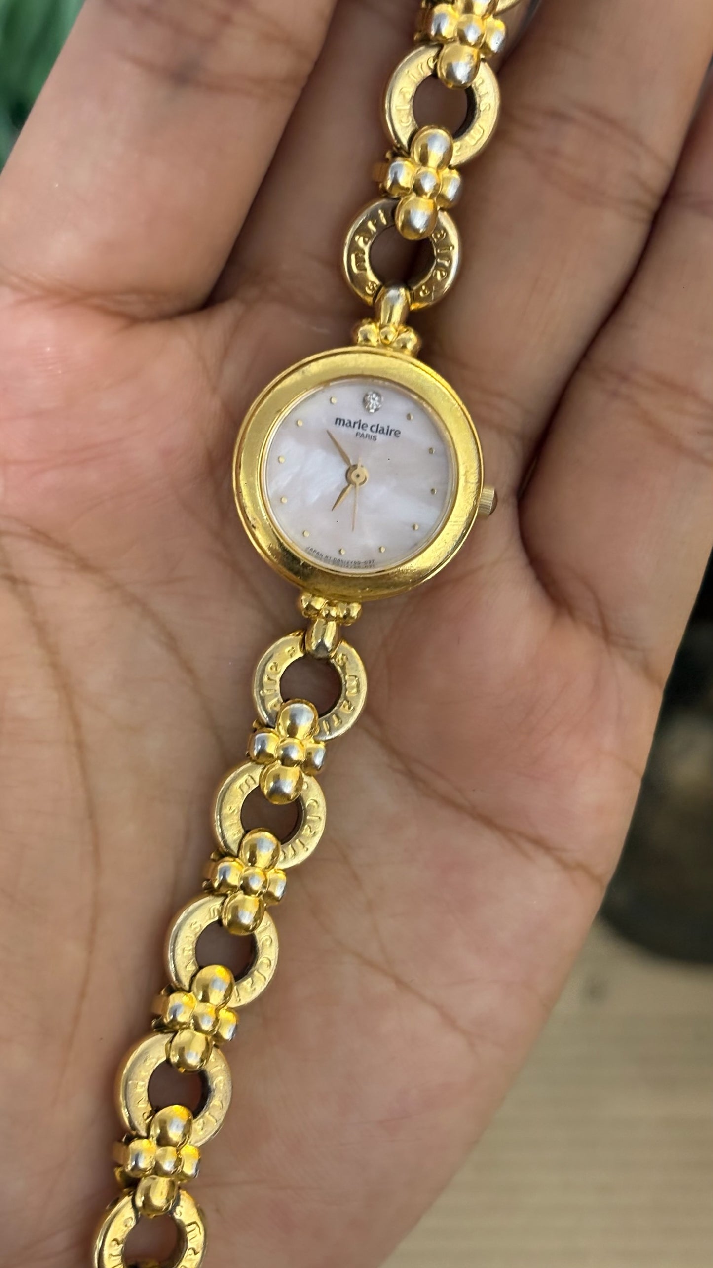 Vintage Marie Claire Round Mother of Pearl Dial Watch with Logo Ring Links in Gold Tone Quartz