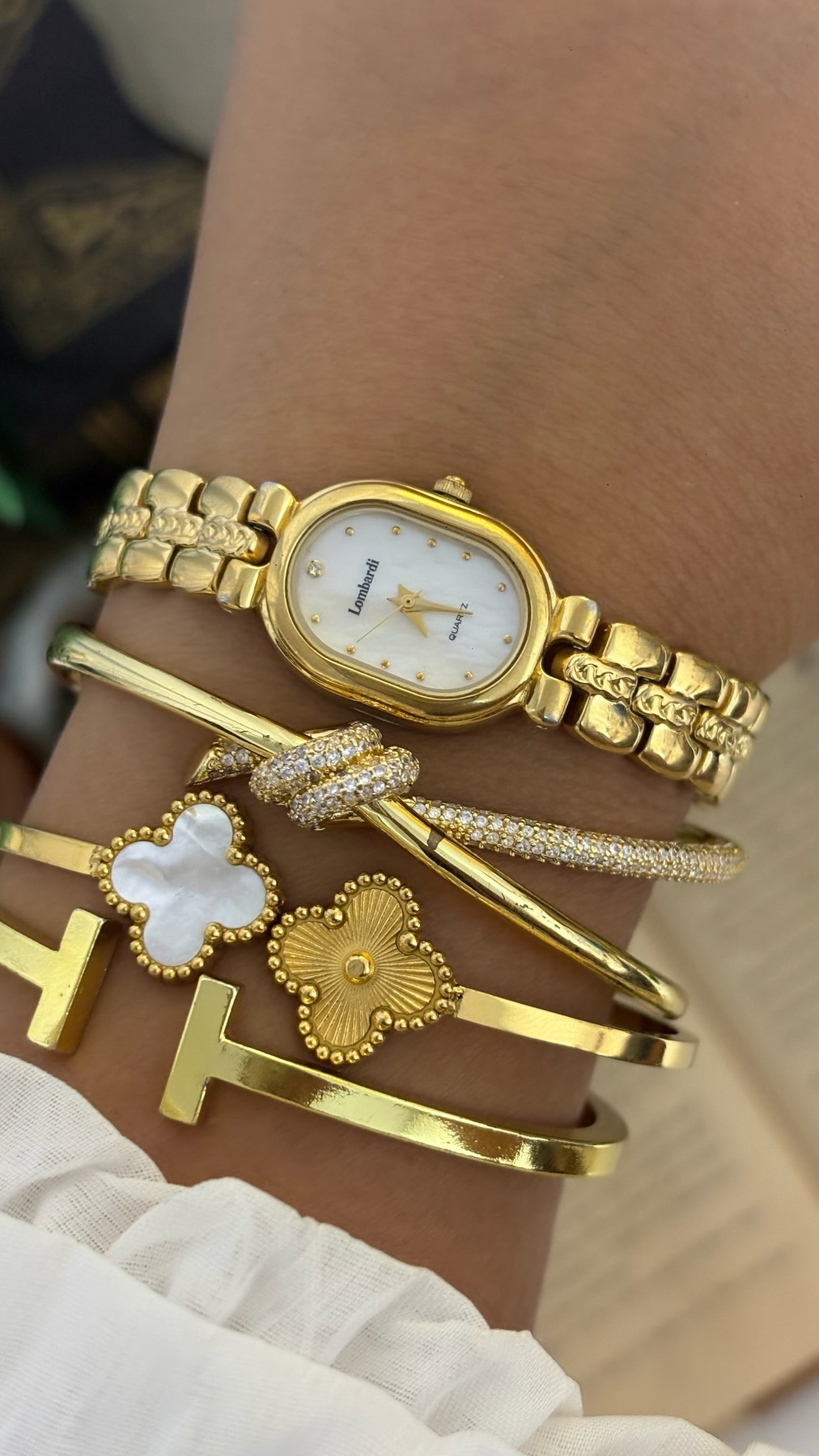 Vintage Lombardi Oval Mother of Pearl Dial Watch with Detailed H-Links in Gold Tone Quartz