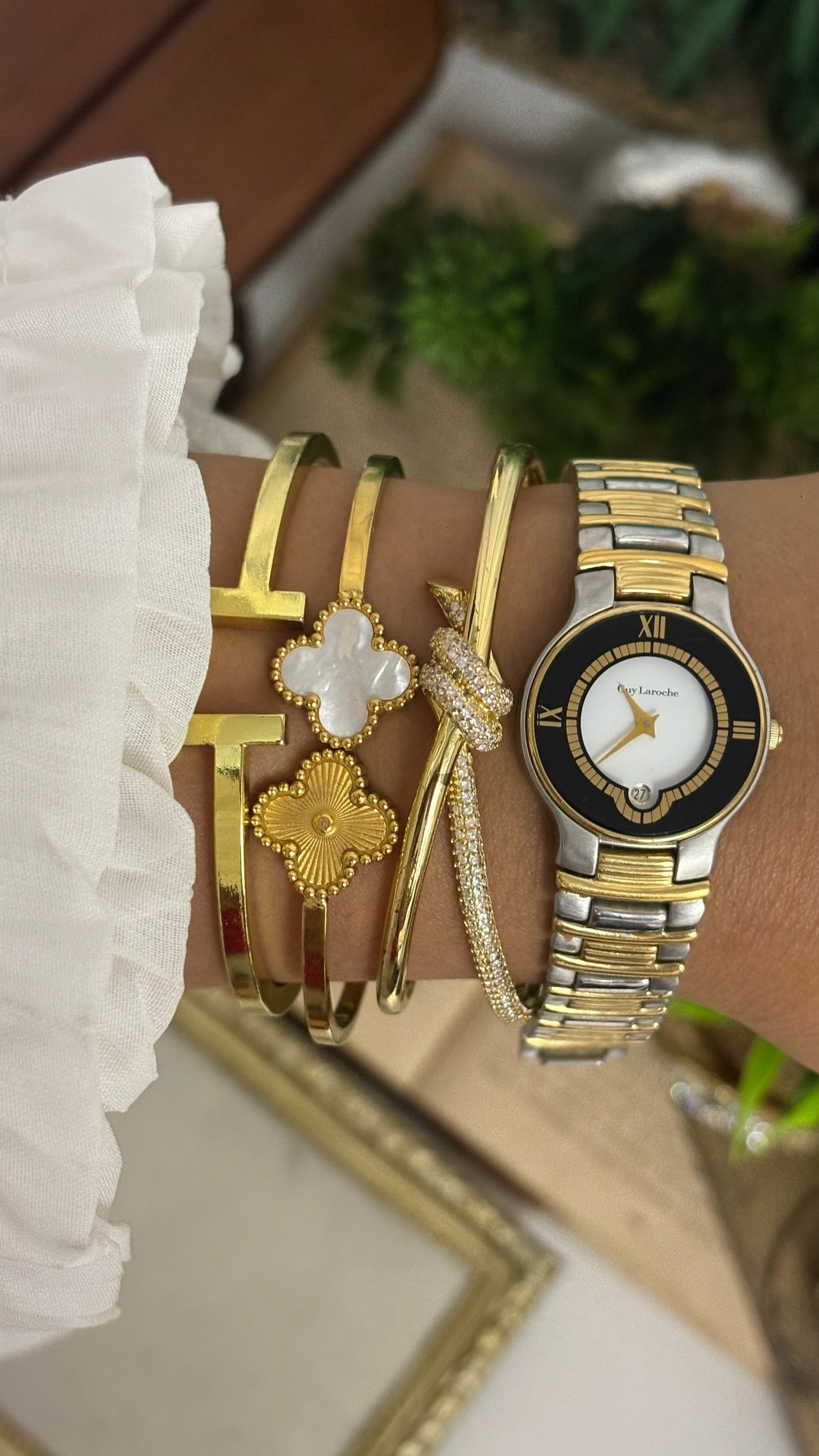 Vintage Guy Laroche Round Watch with Black and Gold Tone Bezel and Two-Tone Link Bracelet