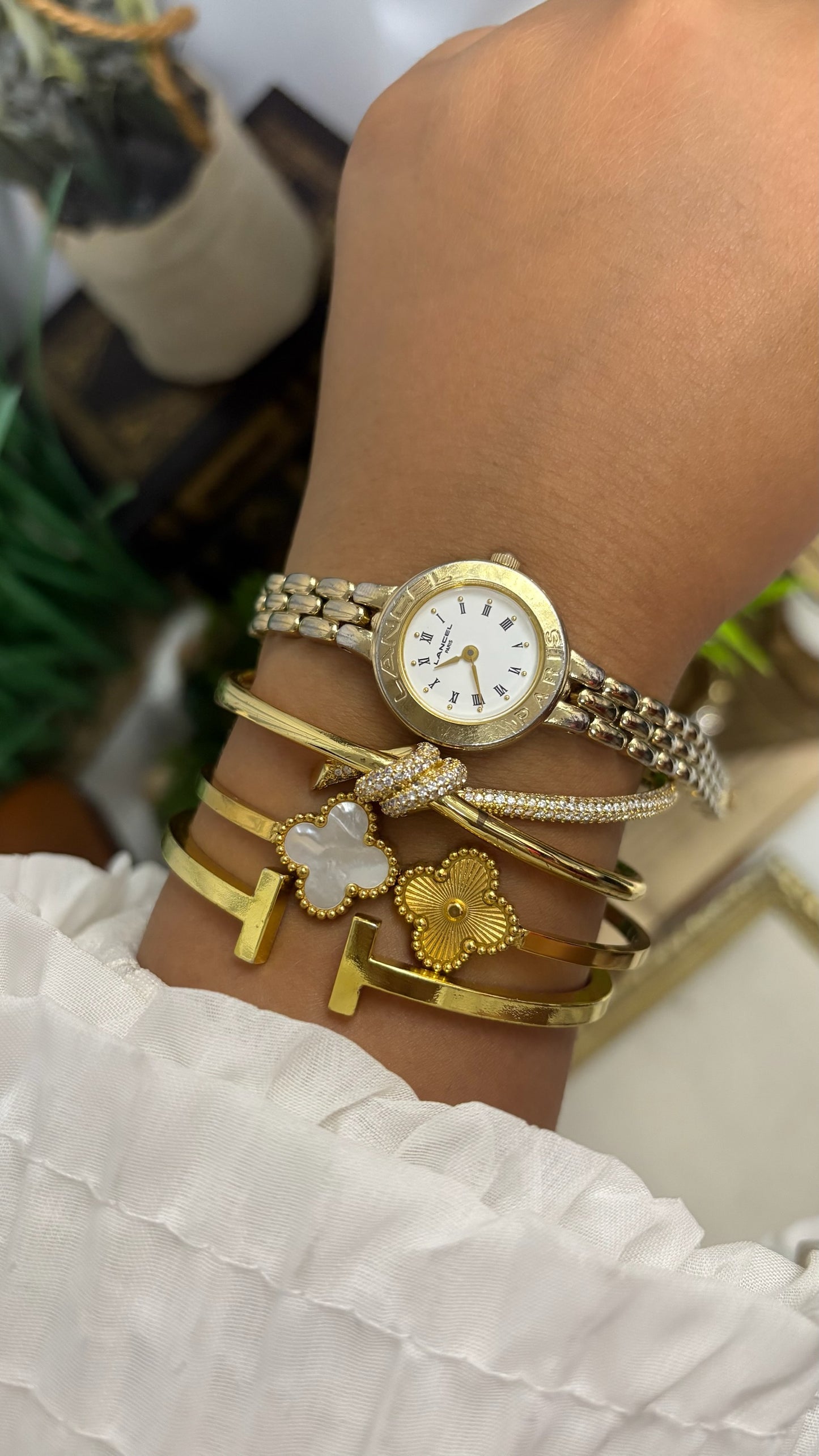 Vintage Lancel Paris Round Watch with White Roman Numeral Dial and Gold Tone Link Bracelet