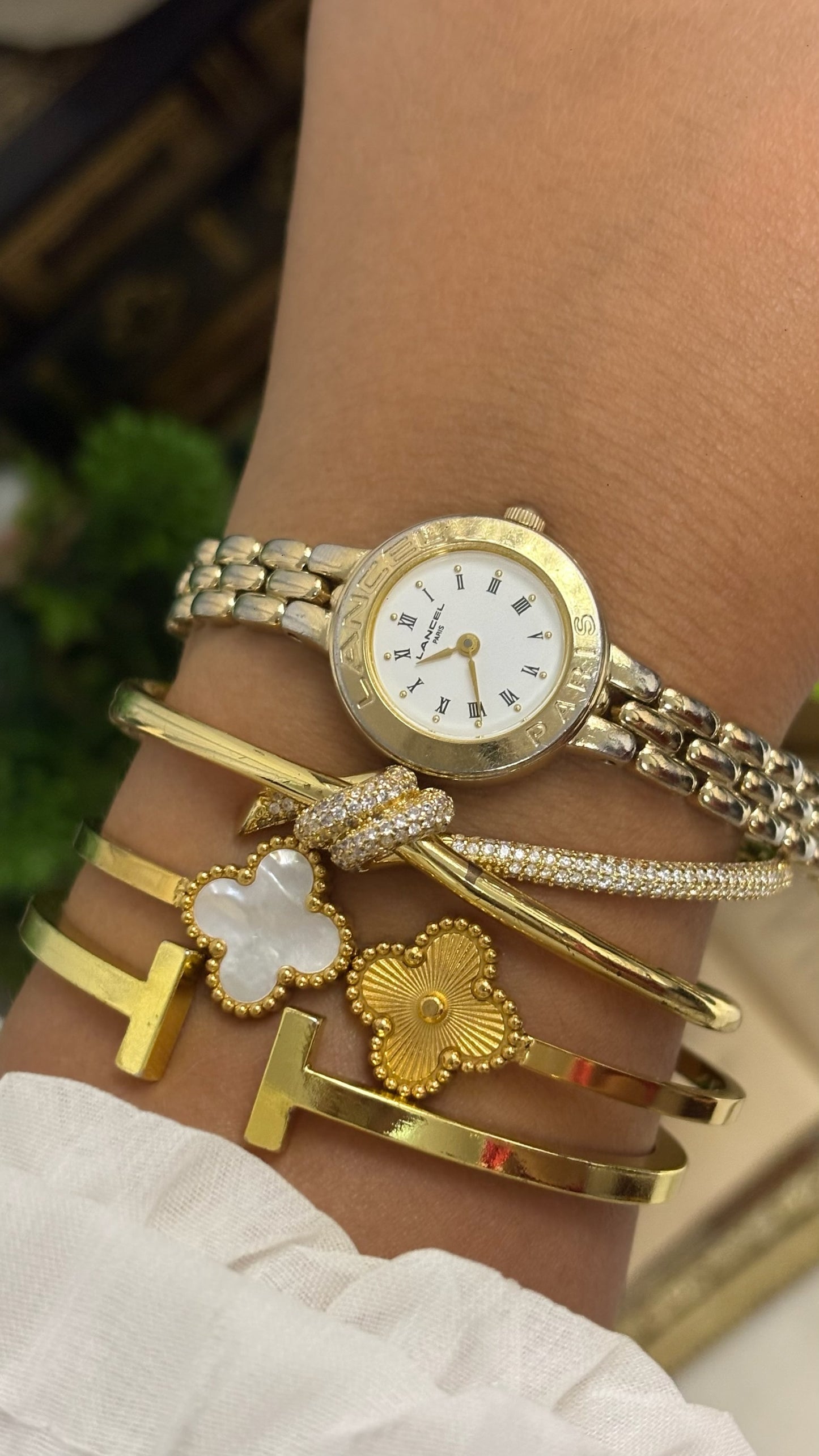 Vintage Lancel Paris Round Watch with White Roman Numeral Dial and Gold Tone Link Bracelet