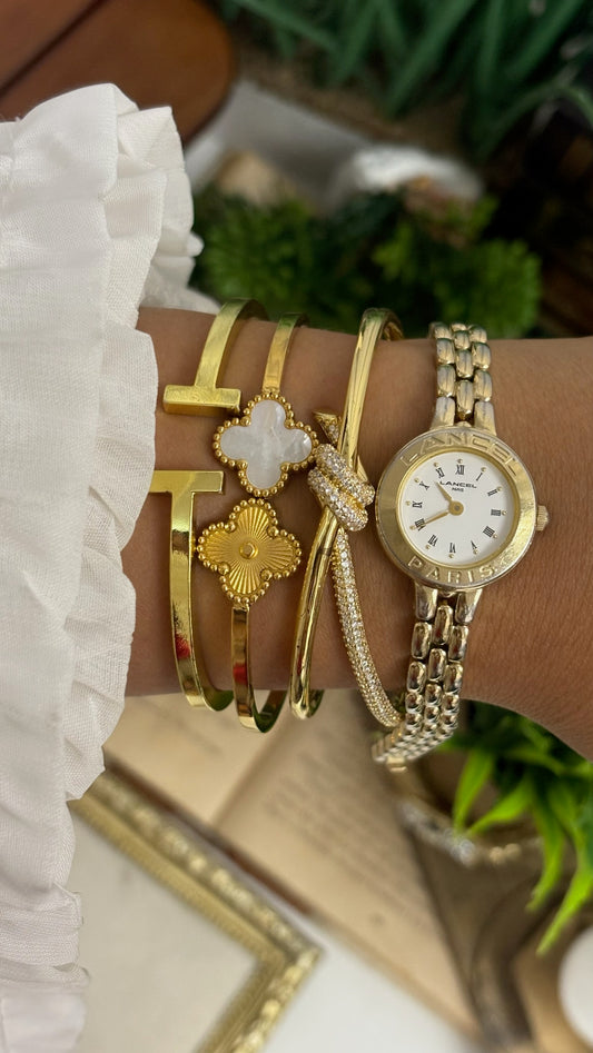 Vintage Lancel Paris Round Watch with White Roman Numeral Dial and Gold Tone Link Bracelet