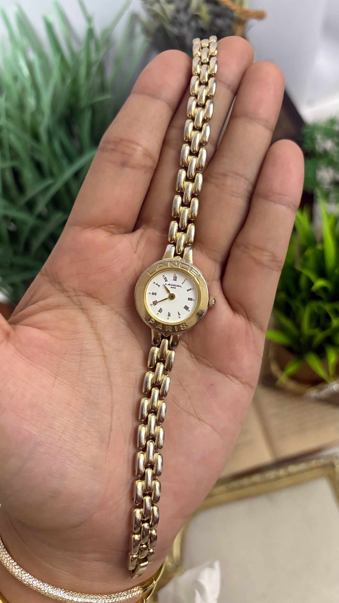 Vintage Lancel Paris Round Watch with White Roman Numeral Dial and Gold Tone Link Bracelet