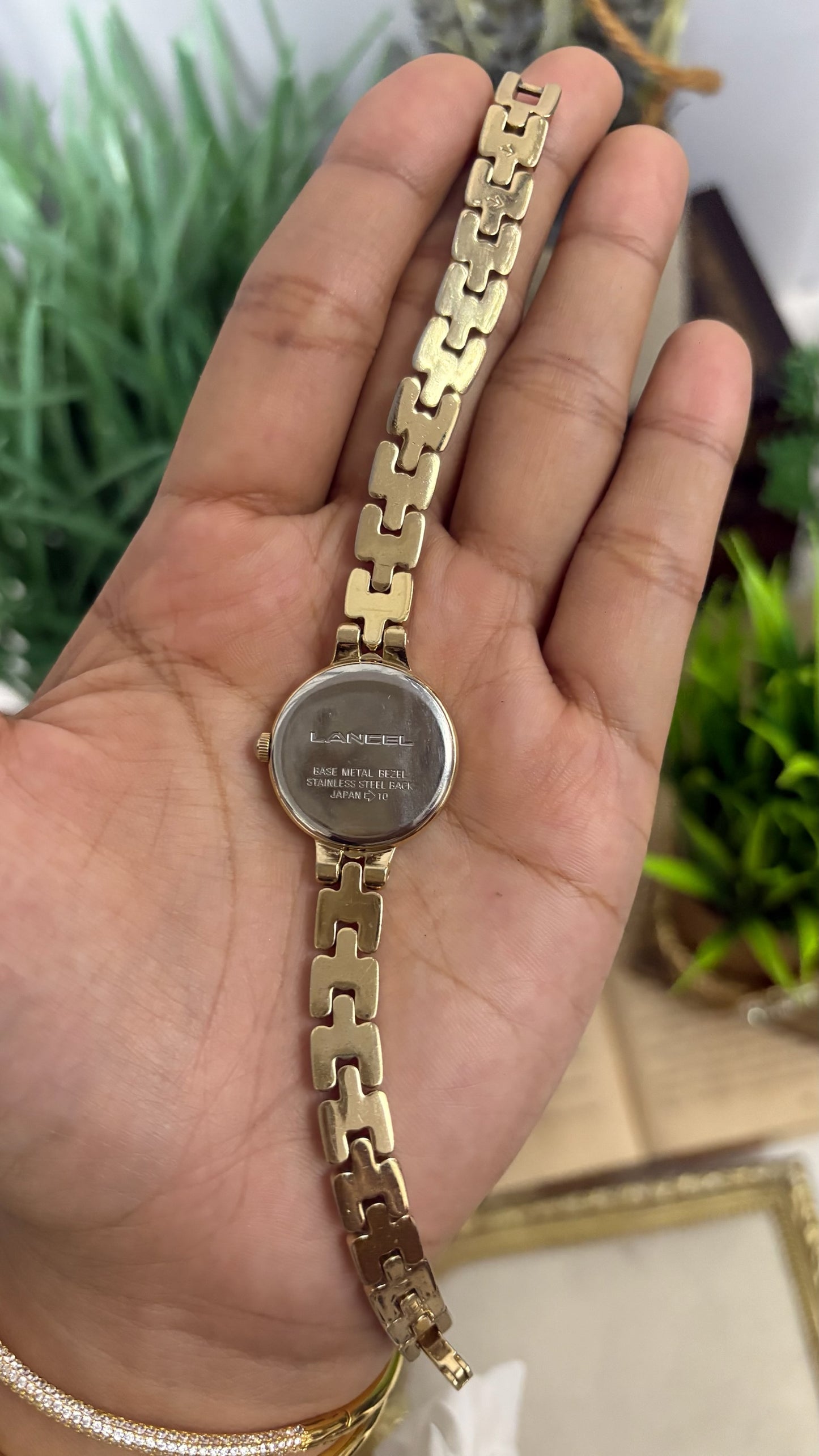 Vintage Lancel Paris Round Watch with White Roman Numeral Dial and Gold Tone Link Bracelet