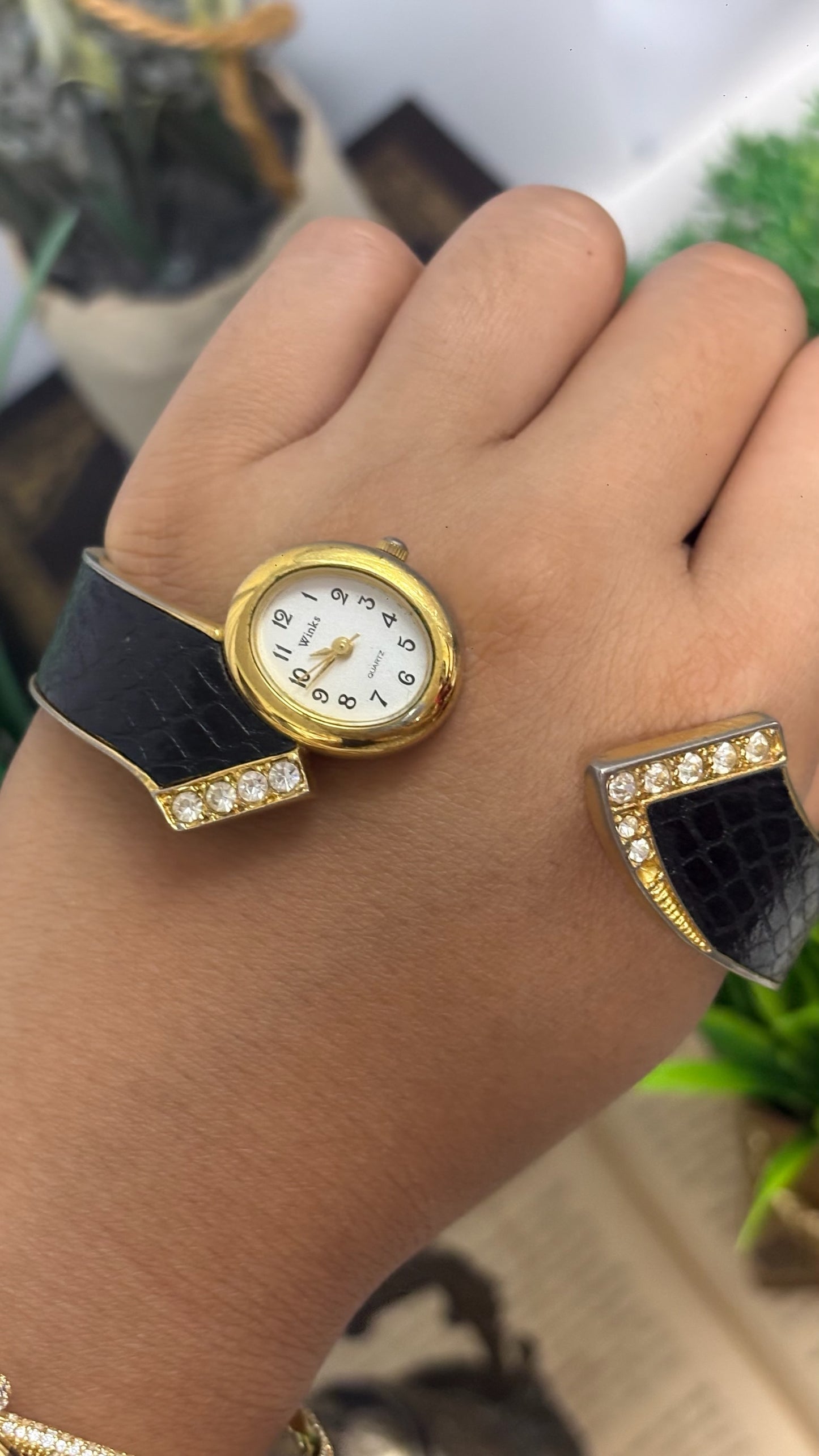 Vintage Winks Oval Watch with Crystal Accents and Black Faux-Leather Inlay Peekaboo Cuff Bracelet Quartz