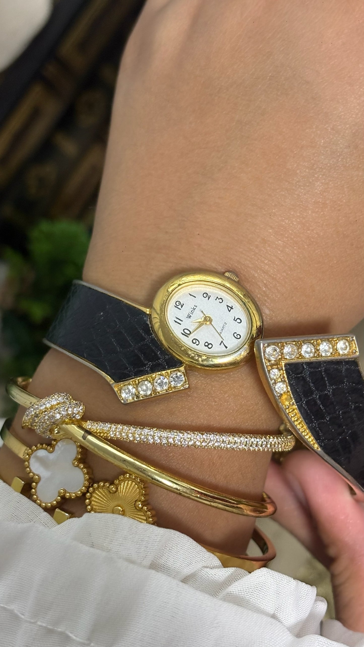 Vintage Winks Oval Watch with Crystal Accents and Black Faux-Leather Inlay Peekaboo Cuff Bracelet Quartz