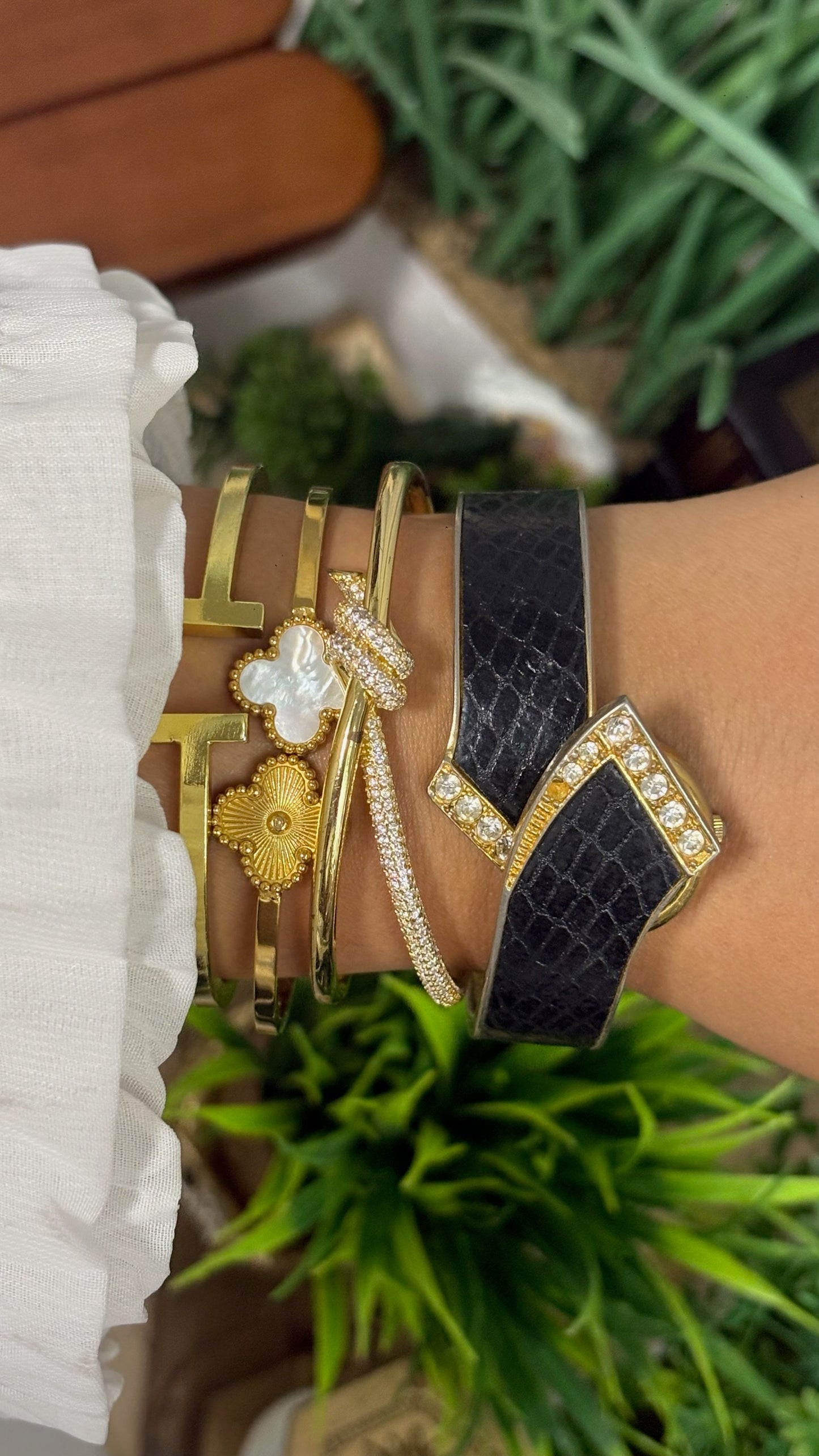 Vintage Winks Oval Watch with Crystal Accents and Black Faux-Leather Inlay Peekaboo Cuff Bracelet Quartz
