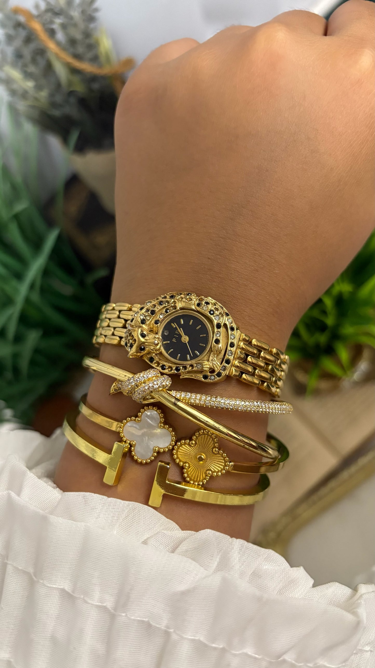 Vintage Erina Gold Tone Panther Watch with Black Dial, Crystal/Black Accents, and Linked Bracelet Quartz