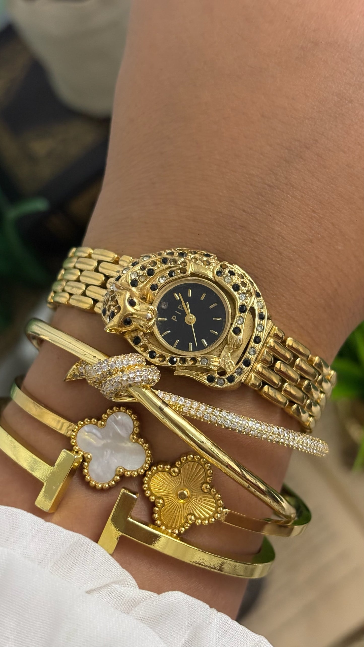 Vintage Erina Gold Tone Panther Watch with Black Dial, Crystal/Black Accents, and Linked Bracelet Quartz