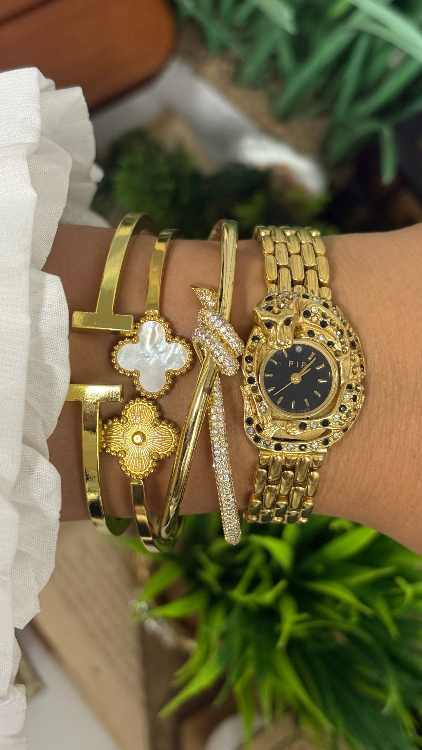 Vintage Erina Gold Tone Panther Watch with Black Dial, Crystal/Black Accents, and Linked Bracelet Quartz