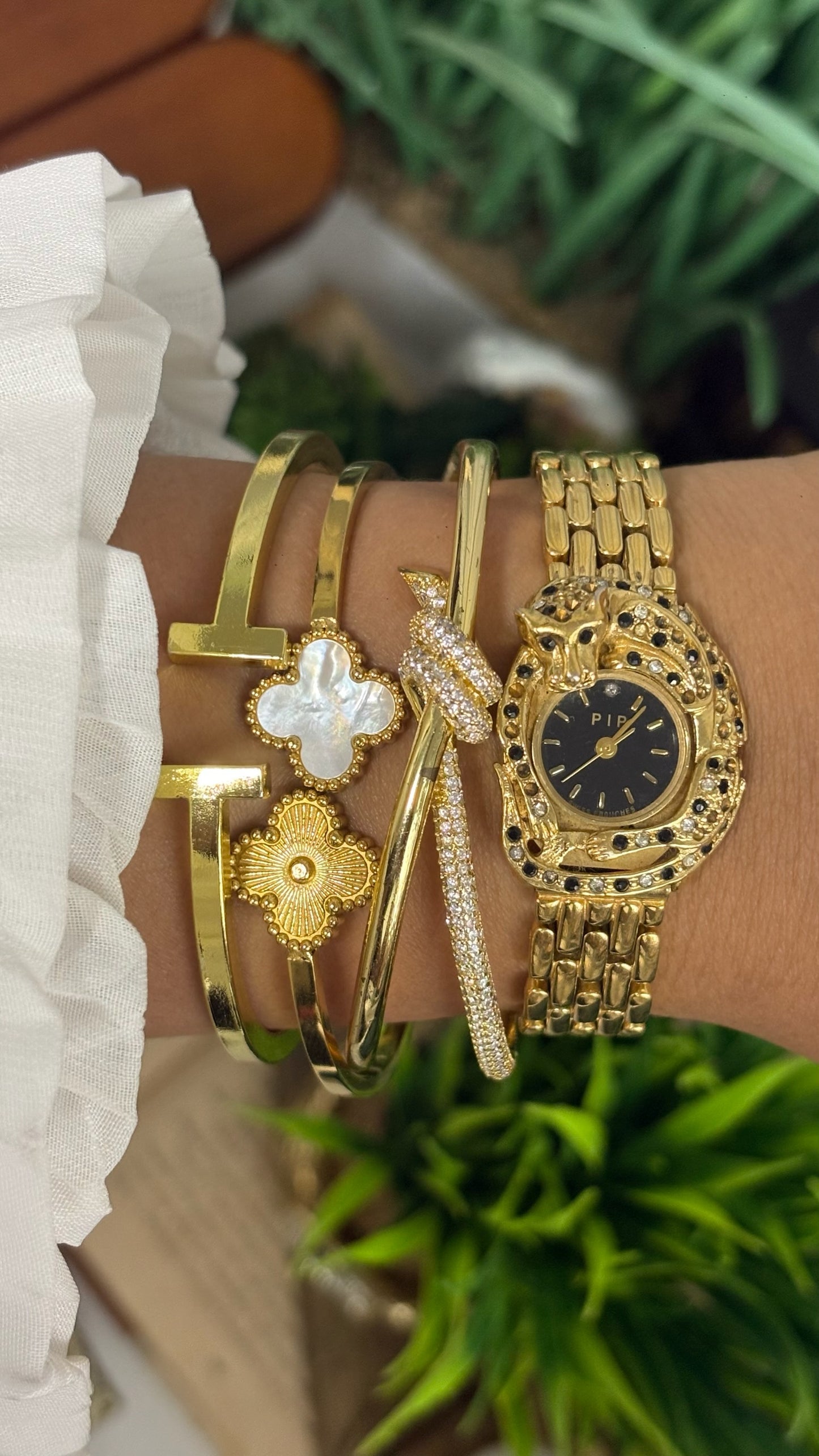 Vintage Erina Gold Tone Panther Watch with Black Dial, Crystal/Black Accents, and Linked Bracelet Quartz