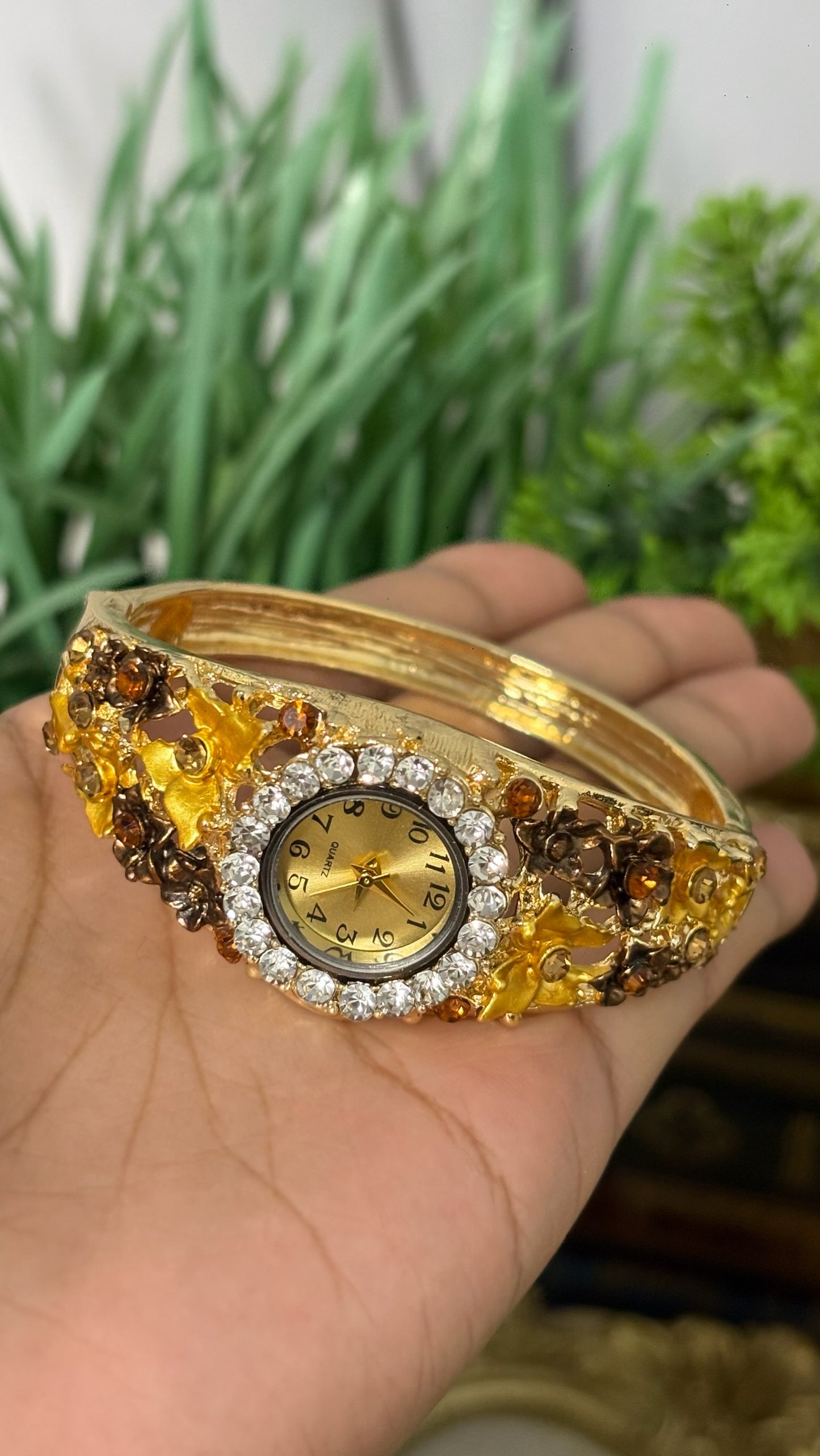 Vintage Japan Quartz Gold Tone Filigree Flower Hinged Cuff Bangle Watch with Crystal Halo Bezel and Amber Accents Quartz