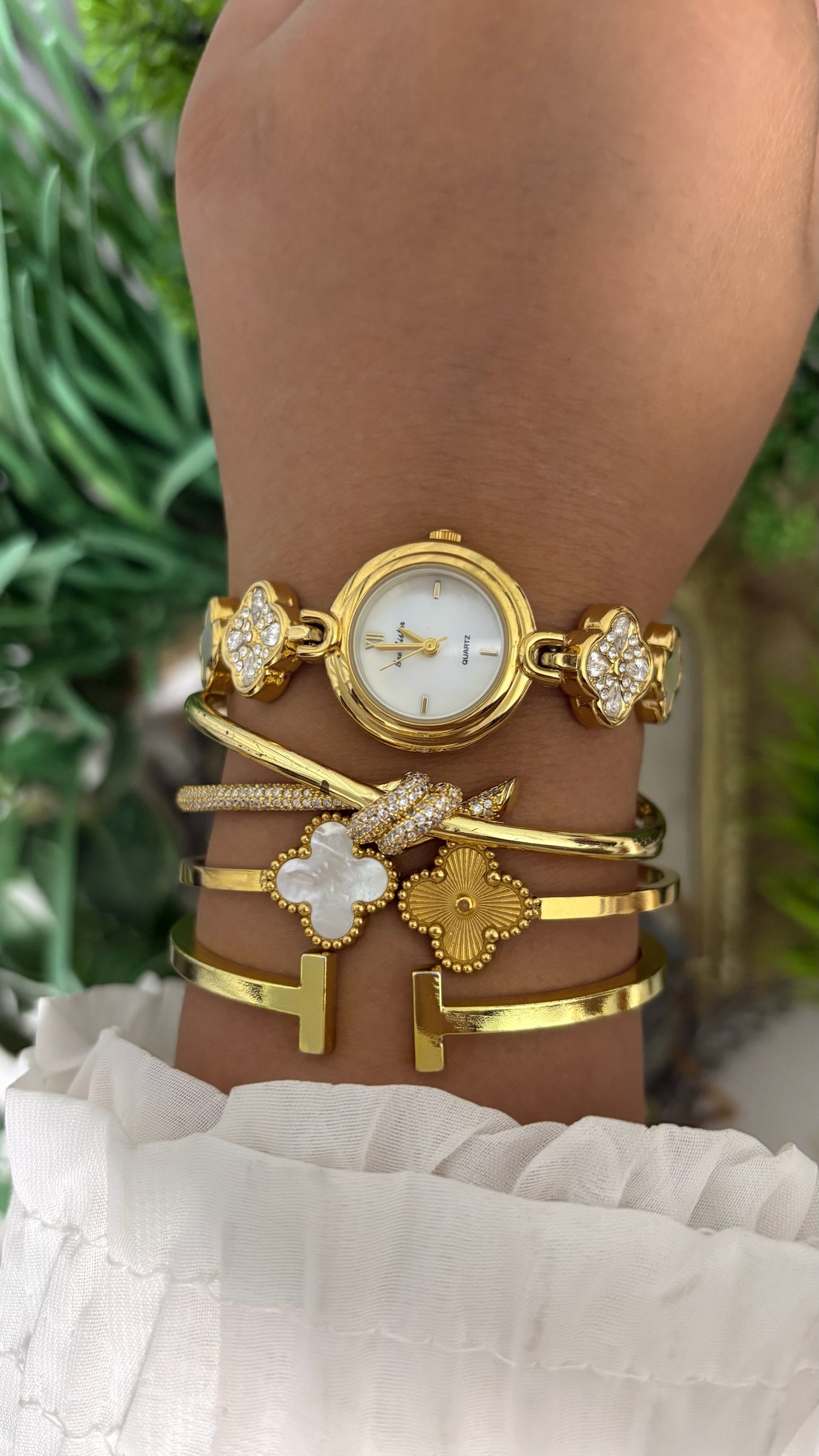 Vintage BS Bee Sister Round Watch with White Dial, Polished Gold Tone Bezel, and Quatrefoil Clover Link Bracelet Alternating with Crystal Pave and White Inlay Details Quartz