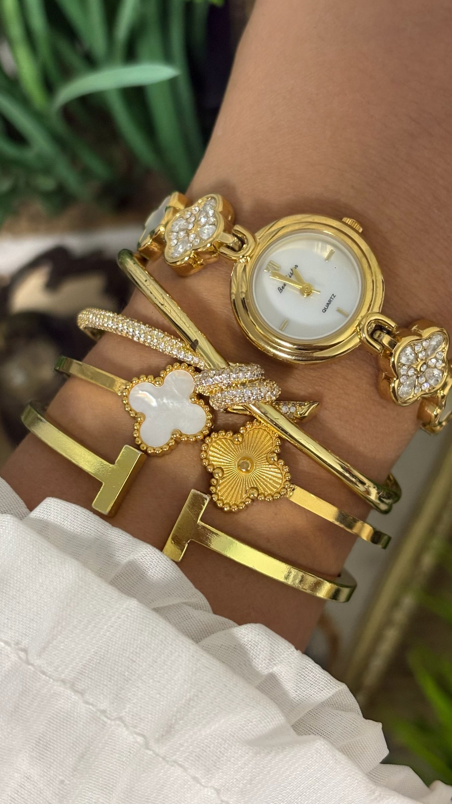 Vintage BS Bee Sister Round Watch with White Dial, Polished Gold Tone Bezel, and Quatrefoil Clover Link Bracelet Alternating with Crystal Pave and White Inlay Details Quartz