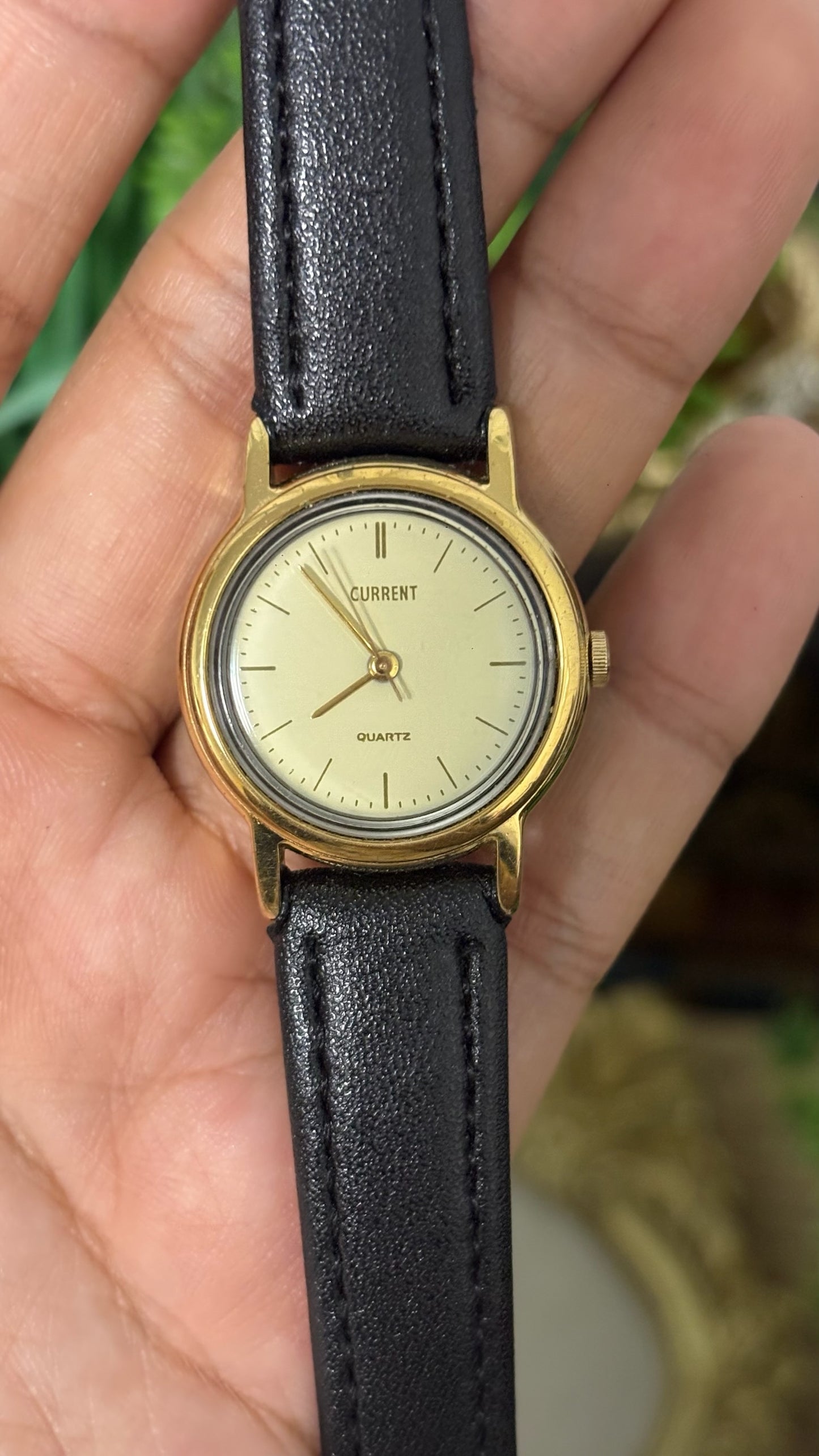 Vintage Current Round Watch with Light Gold Dial Polished Gold Tone Case Slim Stick Markers and Textured Black Leather Strap Quartz